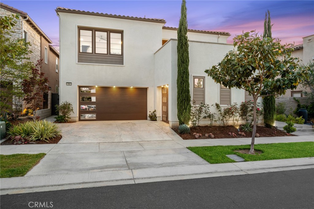 Discover the Epitome of Refined & Upscale Living in Southern California’s Guard-Gated Hot-Spot Destination: Altair, Irvine. Our LIMITED EDITION “Lumiere” Collection Residence 4X home built by Lennar exceeds every expectation and is situated on a Premier Lot Location with Peek-a-Boo Hillside Views! Tucked away within one of Irvine’s most Elite gated communities, the luxurious residence boasts an enviable level of privacy and exclusivity and features 6BD (2 Main Level) 6.5BA (2.5 Main Level) 3-CAR Garage, plus a Loft, Basement (Lounge + Bar + Media Room), Private Front Courtyard, Backyard Covered Patio, Second Floor Covered + Open Deck, & Basement Courtyard! Experience the finest indoor living elements: FULLY PAID OFF SOLAR PANELS, Luxury Porcelain Tile Flooring, Premium Hardwood Flooring, Custom Fitted Window Shades, Crown Molding, Ceiling Fans, & LED Recessed Lighting! Chef-Inspired Gourmet Kitchen with Quartz Countertops, Floor-to-Ceiling Extended White Shaker Door Glass-Fronted Cabinetry, Subzero Built-In Refrigerator + Wine Fridge, KitchenAid Dishwasher, Wolf Appliance Package (Pro Hood, 6 Burner Cooktop + Infrared Griddle, Double Oven, & Microwave), Water Filtration System, & Waterfall Kitchen Island! Luxury Outdoor Retreat with Covered California Room (Wood Deck Ceiling, Porcelain Tile Flooring, Ceiling Fan, & Recessed Lighting), Artificial Turf, & Custom Waterfall! World-Class Amenities exclusive to Altair residents—24 Hour Staffed Gated Entrance, Junior Olympic Pool, Sport Court, Tennis Courts, Clubroom, and Hiking/Biking Trails! Award-winning Irvine Unified School District (zoned Portola High) and minutes from Irvine Spectrum Center, Woodbury Shopping Center, Five Point Amphitheater, & Toll Roads!