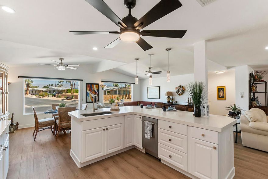 Welcome to Palm Desert Greens, one of Palm Desert premiere 55+ active adult communities. This home has a 433A certification which makes it eligible for financing. This home has been recently remodeled & move in ready. The luxury vinyl plank flooring runs seamlessly throughout the entire home. The kitchen features Quartz counter tops, decorative backsplash, pantry, newer appliances, cabinetry, recessed lighting & designer pendant lighting over the large center island. The dining area allows for entertaining guests along with 2 living areas & a quaint office nook. The primary bedroom features a large walk-in closet & an en-suite bathroom with a step in shower, new vanity & lighting. The secured backyard features a large covered patio, new vinyl fencing for privacy & multiple areas for relaxing under the stars, barbequing & multiple new plantings. Per the seller, other notable updates include new doors, windows, copper plumbing in the bathrooms, sheetrock, interior & exterior paint. Palm Desert Greens is conveniently located near shopping, dining, casinos & medical facilities. This home is perfect as a full time residence or as an investment property. Golf is included for owners in the HOA of $400 per month.