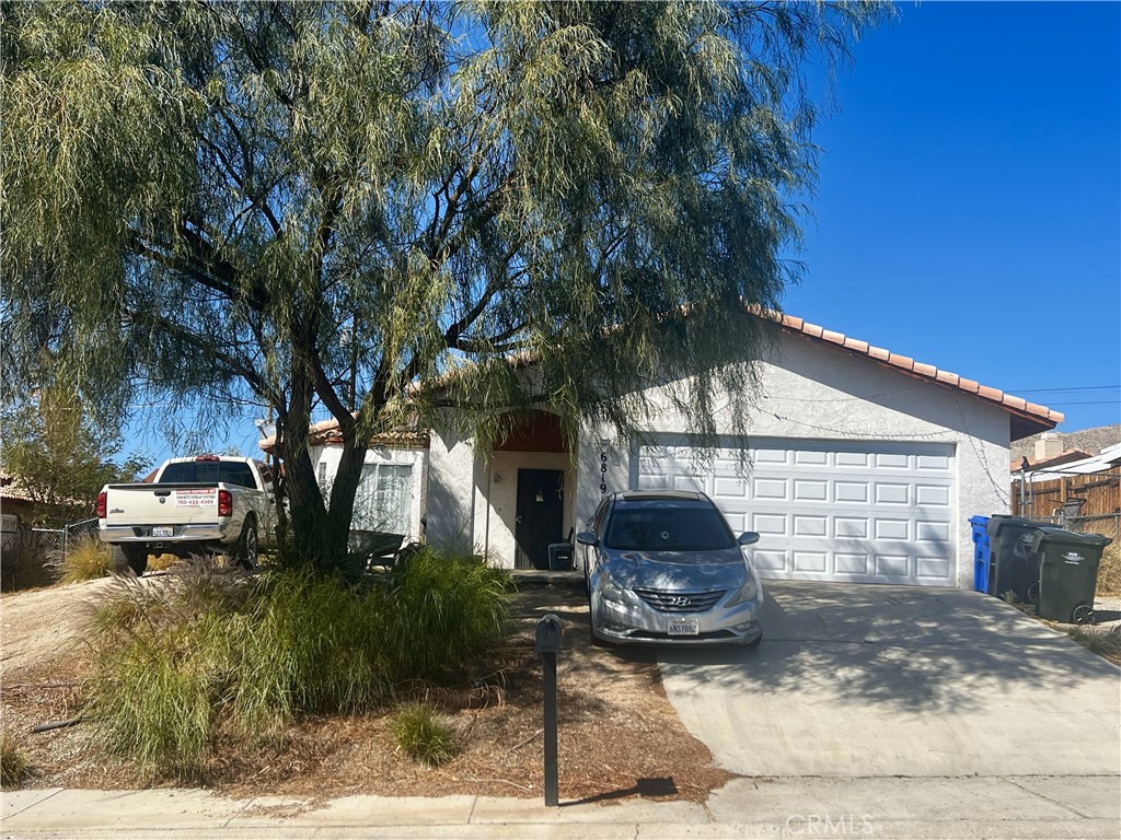 Opportunity Knocks! Hacienda Heights location, close to all that Desert Hot Springs has to offer. Bring your paintbrush and save! PLEASE DO NOT DISTURB THE OCCUPANTS OR THEIR LARGE GUARD DOGS. This home offers the perfect opportunity to make it your own. A functional open floorplan with direct access to attached two-car garage and direct backyard access make this single story living at its best. Main bedroom has ensuite bath and all bedrooms are generously sized. South facing and tile roofing for the energy conscious buyer. Call to see this today