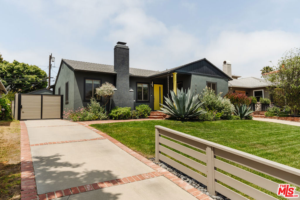Could this sun-drenched North Kentwood home with a design-forward interior elevate your everyday? Positioned on one of the neighborhood's most desirable streets, this single-story stunner welcomes you in with a brick pathway leading to an open-concept residence that's been stylishly reimagined and fully permitted! Gleaming original White Oak Hardwood floors stretch across the layout, paired with elegant crown molding, neutral hues, and recessed lighting that creates a polished, upscale tone. Its modern kitchen invites you to indulge while cooking with Caesarstone countertops, stainless steel appliances, a built-in wine rack, and a clever coffee bar hidden behind bifold doors. Penny Round tile and custom cabinetry add depth to its functionality, making every morning feel effortless. The main living area is anchored by a re-tiled fireplace flanked by sun-filled windows, ready for you to unwind or entertain. The generously sized primary suite is your personal haven, offering direct access to a trellis-covered patio and a serene ensuite with a frameless glass shower and separate soaking tub. Outside, the swim spa and beautifully manicured landscaping beckon you to enjoy the outdoors year-round. The detached garage has been partially converted into a stylish recreation room or remote office, while still maintaining ample storage space for all your tools and toys. The solar system with eight high-output panels allows for sustainability while keeping you on budget. A custom architectural gate and driveway complete this abode's smart exterior. Set only minutes from LMU, Playa Vista, Marina del Rey, LAX, and the Westside's best beaches, this home delivers the ideal balance of accessibility and retreat. Come experience a place where sophistication meets comfort, and everyday living feels just right!