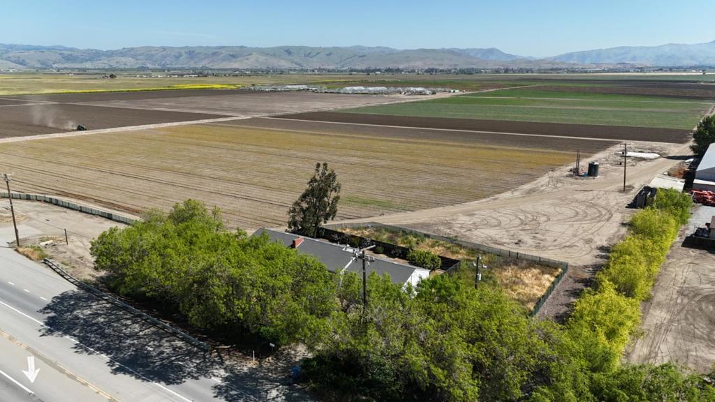 Discover a rare opportunity to own nearly 50 acres of prime farmland in Northern Hollister, part of San Benito County's rich agricultural heritage. This income-producing property features a well-maintained, upgraded 2,000 sq ft home with 3 bedrooms and 2 bathrooms, offering sweeping views of the open valley and surrounding mountains. The land is currently leased to a local farmer, generating immediate revenue, and is supported by an agricultural well that also services the home. Ideally located along Highway 25, you're just minutes from downtown Hollister and a short drive to the Southern end of Santa Clara County and Silicon Valley, perfectly balancing rural serenity with urban accessibility. Whether you're an investor seeking steady rental income or a homeowner wanting to embrace country living with modern comforts, this versatile property holds endless potential. Don't miss your chance to own a piece of San Benito County's farming legacy!