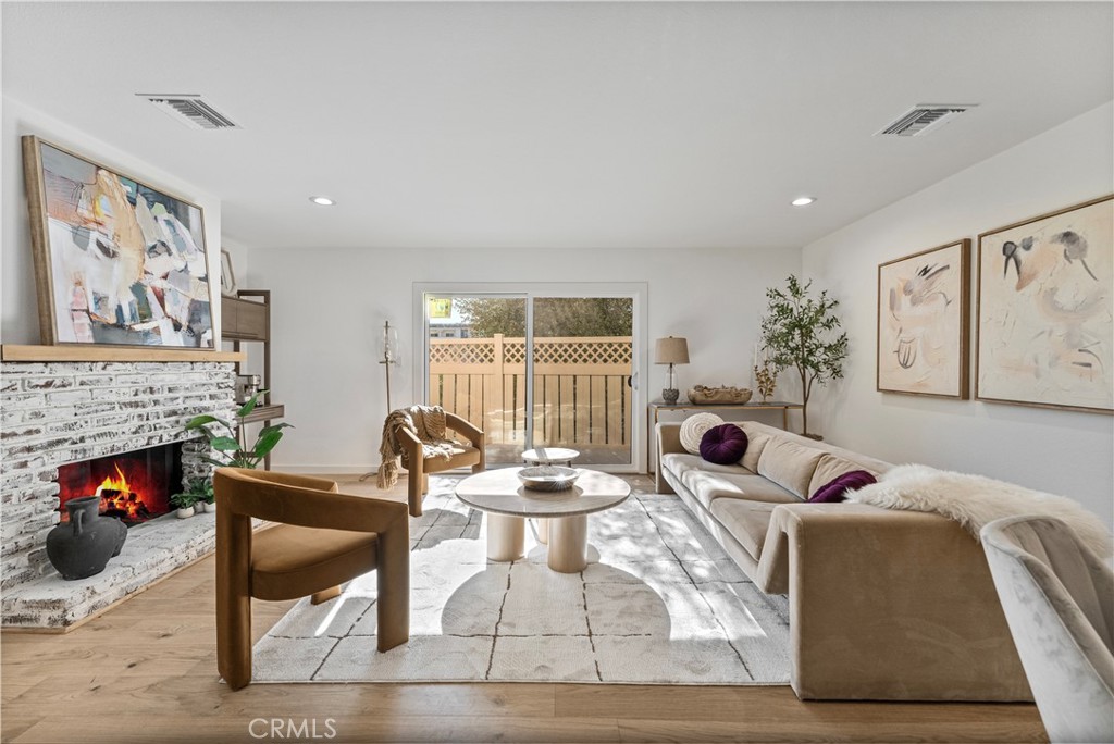 Beautifully remodeled and spacious, this bright 2-bedroom, 2.5-bathroom home boasts an open-concept design. Located on a serene street near the Culver Blvd bike path, the property features a private patio—ideal for entertaining or relaxing. The stunning kitchen has been completely transformed, showcasing brand-new flooring, custom cabinetry, quartz countertops, a modern sink and faucet, recessed lighting, and stainless-steel appliances, including a stove, dishwasher, and microwave. A welcoming breakfast bar makes it perfect for casual dining and lively conversations. The kitchen seamlessly flows into the dining area and living room, creating an inviting space for gatherings. The living room features new wood flooring, an updated fireplace with ceramic tile and gas logs, fresh paint, and elegant crown molding, all leading to the expansive patio. Upstairs, you'll find two spacious master suites, each with tastefully renovated en-suite bathrooms. Additional updates throughout the home include fresh paint, new interior doors, updated lighting, and beautifully designed stairway railing. The property includes a gated underground parking area with elevator access, The complex offers a swimming pool and a unique private park, enhancing the community's charm. Conveniently located near the 10, 405, and 105 freeways, this home is situated on a peaceful cul-de-sac, just minutes from the Ballona Creek bike path, Mar Vista’s renowned farmers market, and an array of fantastic local restaurants. Combining comfort, convenience, and character, this townhome is a true gem.