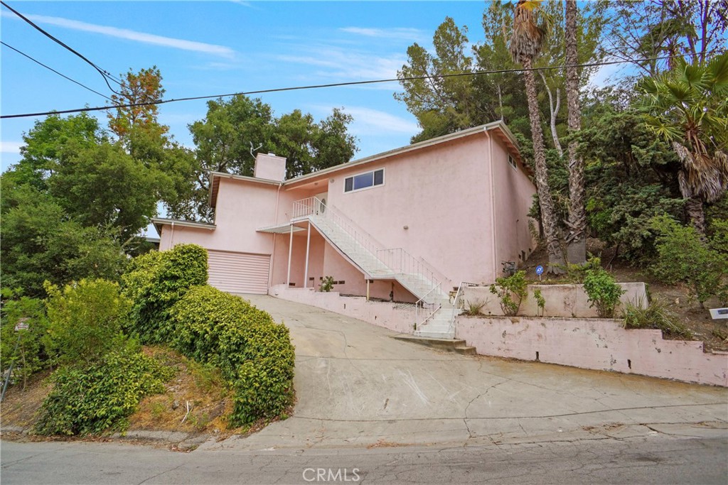 Huge Price Improvement! This is the opportunity you’ve been waiting for—an investor or owner-user dream in one of Studio City’s most coveted neighborhoods. Whether you're planning to build your modern dream home or remodel and flip for big returns, the potential here is endless. This 2-bedroom, 2-bath home offers nearly 1,400 sq ft of living space on a generous 6,500 sq ft lot, featuring a spacious backyard with great entertaining space and a private spa to unwind. Enjoy beautiful city and mountain views from the front of the home, plus added perks like a detached two-car garage, fresh interior paint throughout, and a tankless water heater. Rare finds like this don’t last—act fast!