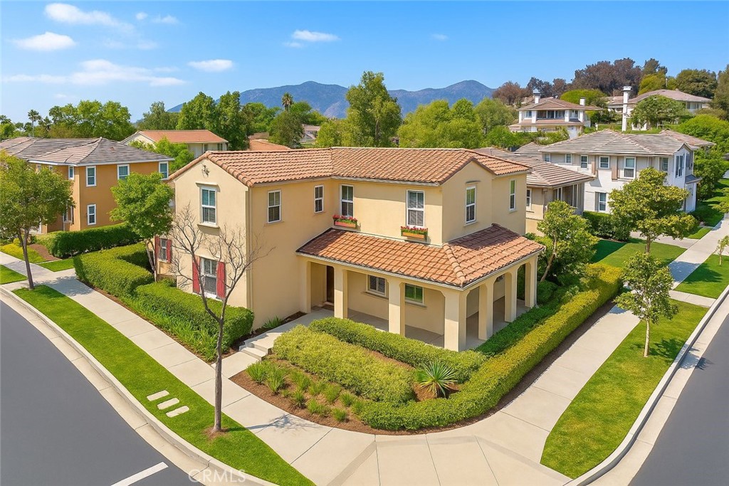 Welcome to Rosedale, 929 Cornejo Way. This spacious 3 bedroom, 3 bath residence features soaring ceilings and an open floor plan. Large windows flood the interiors with natural light, creating a warm and inviting atmosphere. The kitchen is equipped with stainless steel appliances, granite countertops, an oversized island, and cabinetry, making it ideal for both everyday cooking and gourmet meals. Upstairs, the primary suite offers a spa-like bathroom with a walk-in shower, separate soaking tub, and a generously sized walk-in closet. An additional loft area provides flexible space for an office, den, or playroom. The private backyard has been thoughtfully designed with full upgraded tile flooring, requiring minimal maintenance—perfect for outdoor gatherings or simply relaxing in a serene setting. A two-car garage with wall-to-wall cabinets provides abundant storage space. Located in the sought-after Azusa Rosedale community, San Gabriel Valley’s only master-planned neighborhood with a total of 1,250 homes, residents enjoy access to multiple parks with playgrounds, walking trails, and sports facilities. Sierra Madre Park showcases stunning views and amenities including a basketball court. The Promenade offers a peaceful walking path, while The Resort features an Olympic-sized pool, fitness center, and outdoor cooking areas. The newly built Great Park provides even more open space for biking, walking, community events, fitness, and children’s play areas. Conveniently located near the Metro Station with a local fire station nearby, this community offers both accessibility and peace of mind. Don’t miss this beautiful home!
