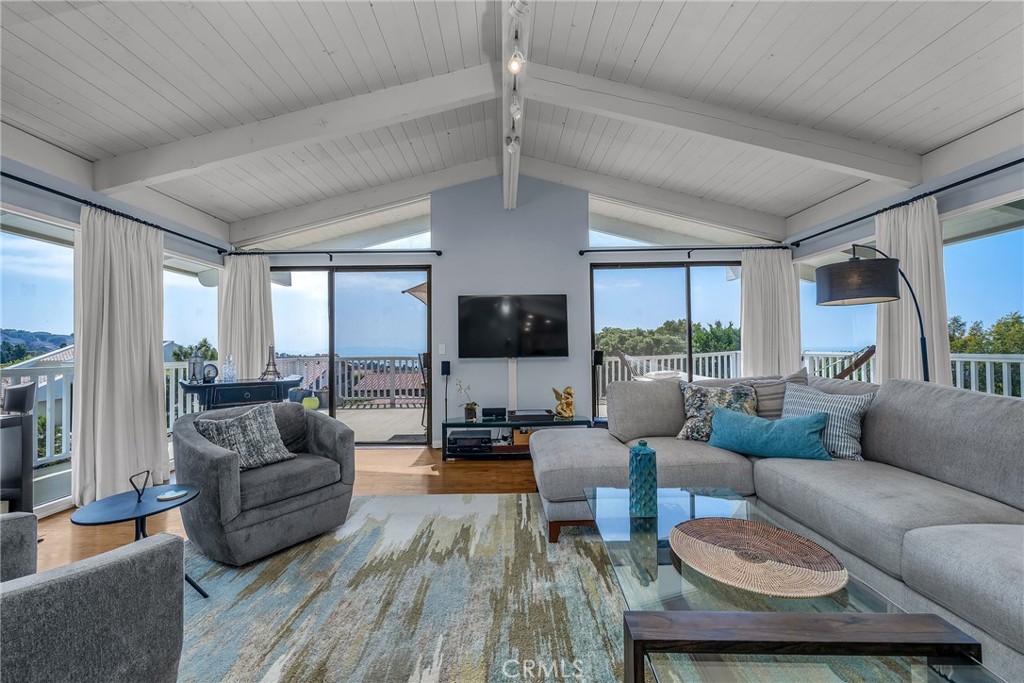 Fabulous ocean views from this contemporary 5 bedroom, 5 bathroom home in Upper Lunada Bay. Tons of light floods in from windows everywhere, to enjoy colorful sunsets and ocean breezes. Well placed decks surround the living room and off 4 of the bedrooms. Magnificent kitchen was recently remodeled – quartz countertops, stainless steel appliances, huge island, tall large expansive windows and an ocean view. One bedroom/family room has been converted to an ADU with a separate entrance if wanted. ADU/family room has a cozy fireplace, French doors with private patio, small fridge and built in cabinets plus remodeled private bath. Large master with private bath also includes a private entrance with access to the backyard. Two bedrooms share a “jack and jill” bathroom. House includes Air Conditioning, newer heater (2023), newer roof (2024 - original Spanish tiles used with all new underlayment). Whole house water filtration system recently installed. Attached large two car garage with additional storage. House is partially remodeled and ready for a new owner to make it perfect. Palos Verdes Estates is well known for its top ranked schools, incredible coastline, and quaint small town feel including concerts in the park, local small restaurants and a small local grocery store... And a recently opened Coffee Shop and Creamery!