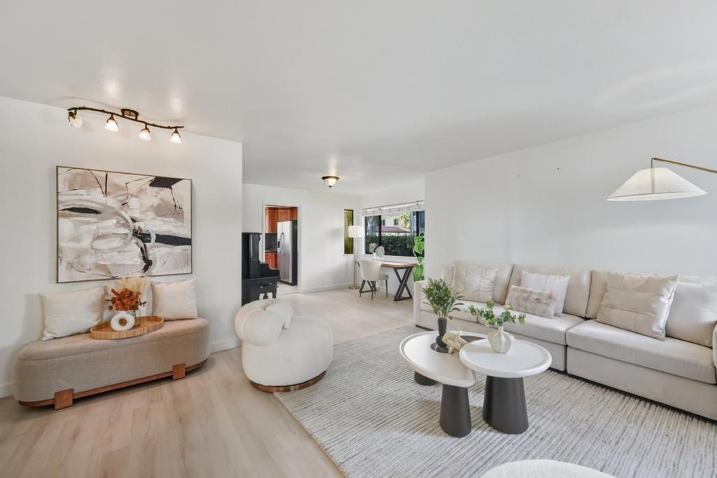 Recently remodeled end unit townhouse in a very quiet and convenient location! Walking distance to Downtown Mountain View, just minutes to Google office, Computer History Museum and Shoreline Park. Easy access to public transportation and Highways 101 and 85. This updated townhome offers three bedrooms and two-and-a-half bathrooms. On the main level, the living room features an electric fireplace, the dining room connects to the kitchen for easy entertaining, and the family room sits open to the kitchen with a wide sliding glass door to the private backyard and garage. Upstairs, the spacious primary suite has two extensive closets and a large recently rebuilt balcony, while two additional well-sized bedrooms with a shared full bath. With vaulted ceiling in the primary bedroom, new SPC floor, fresh paint, new furnace and new water heater, and many more upgrades! This home is move in ready!