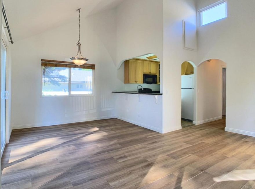 Move-In Ready Top Corner Unit in Gated Canyon Villas.  Welcome to this pristine 2B/2B condo located in the gated Canyon Villas community. The open floor plan features vaulted ceilings, new flooring, custom paint, and granite countertops in the kitchen. Enjoy the space above the kitchen, perfect for extra storage.  Step outside to your private balcony with a large storage closet. The primary suite includes mirrored closet doors and an additional linen closet, while all appliances — including in-unit laundry with washer, dryer — stay with the home.  The community offers beautifully maintained, park-like grounds with mature landscaping, BBQ areas, and plenty of visitor parking. This unit includes one designated parking space within the gated complex.  Located just minutes from Sweetwater Lane Community Park, vibrant shopping centers, and diverse dining options. Easy access to CA-125 ensures a smooth commute.