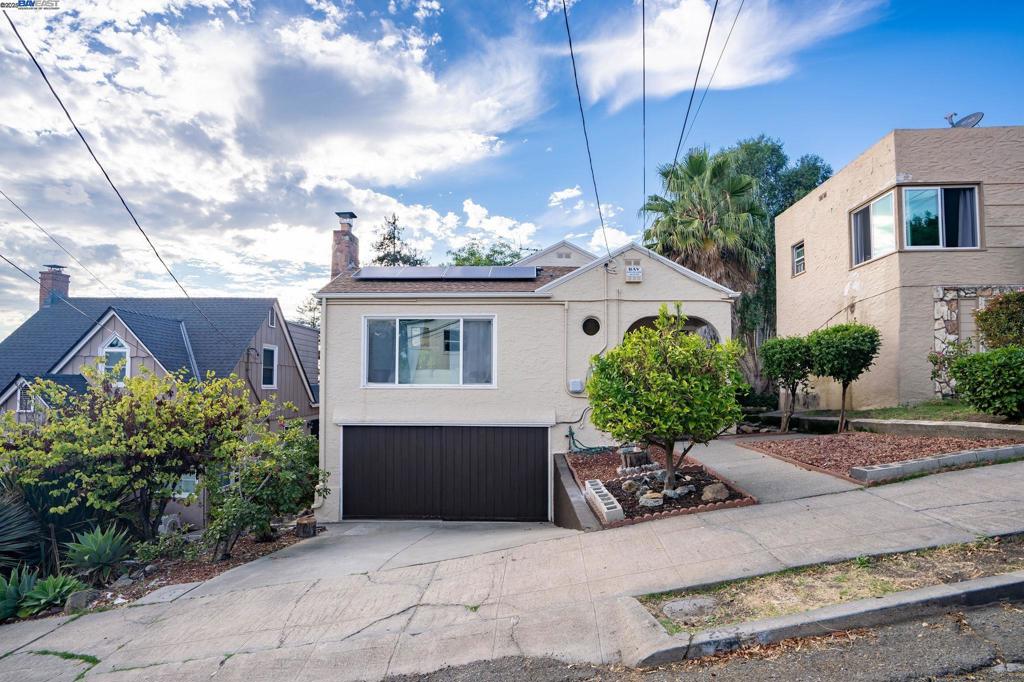Stunning Oakland Hills home, stylishly updated with your family in mind! This 4 bedroom, 2 bath home boasts nearly 1600 sq ft of open, airy fabulousness, offering the best of both worlds by preserving the charm of bay area mid-century architecture while allowing you to enjoy the modern comforts and elegant touches you’ve come to enjoy. The open layout connects the kitchen, dining, and living areas, making it ideal for everyday living and entertaining family and friends. The kitchen features granite countertops, new stainless-steel appliances, and a clean, contemporary design. Beautiful hardwood flooring, formal dining, modern bathrooms, sizeable bedrooms, ample storage, a laundry room and gorgeous views from multiple spaces round out the interior. Kids of all ages will enjoy indulging in the expansive, photogenic backyard with river rocks, citrus trees, solar lights and generous space for your personal garden. Fully owned solar is icing on the cake! Quick, easy access to 580 and the Oakland Zoo adds to the convenience of this prime location, with new shops and community spaces in development at Oak Knoll. This is the one your family will proudly call home!