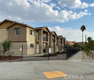 Newer townhome in gated complex. This property is located 2 miles away from California State University of San Bernardino, close to shopping center and restaurants. 3 bedrooms, 2.5 bathrooms, an upstairs family room and a nice balcony with beautiful mountain view, 2 car garage, laundry hookups in the garage, kitchen with pantry, stove, dishwasher and refrigerator. There is a playground and picnic/grill area for common use, nice landscaping and fully fenced. solar.