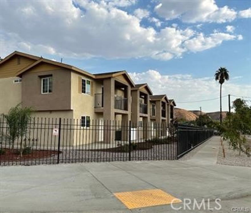 Newer townhome in gated complex. This property is located 2 miles away from California State University of San Bernardino, close to shopping center and restaurants.  3 bedrooms, 2.5 bathrooms, an upstairs family room and a nice balcony with beautiful mountain view, 2 car garage, laundry hookups in the garage, kitchen with pantry, stove, dishwasher and refrigerator. There is a playground and picnic/grill area for common use, nice landscaping and fully fenced. solar.