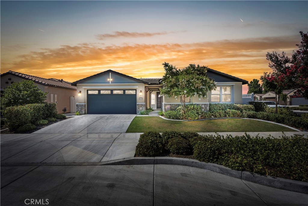 Welcome to this impressive 3-bedroom, 2-bath home offering 2,131 sq. ft. of stylish living, built in 2021 and situated on a desirable corner lot. Step into a welcoming foyer that opens to an expansive great room and formal dining area—perfect for entertaining. Soaring vaulted ceilings and wood-look tile flooring create a spacious, elegant feel throughout. The split-wing layout ensures privacy, with the primary suite featuring a tastefully remodeled custom shower for a spa-like retreat. Enjoy indoor-outdoor living with a fully landscaped backyard, complete with a covered patio ideal for relaxing or hosting guests. This move-in ready home blends comfort, functionality, and modern design in every detail.