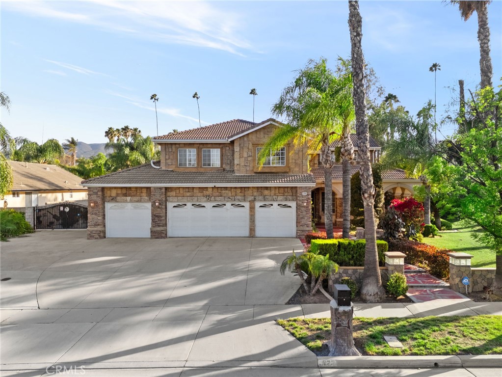 Welcome to 922 Armata Drive, a stunning custom estate in the prestigious Amberhill community—where elegance, entertainment, and functionality converge on nearly an acre of impeccably designed land. From the moment you arrive, you’re greeted by an expansive hardscape walkway leading to grand double doors and a spacious entryway with soaring ceilings and custom woodwork that sets the tone for the craftsmanship found throughout. At the heart of the home, the gourmet kitchen is a showstopper—featuring a built-in refrigerator, chef-grade stainless steel range with pot fillers, quartz backsplash, and a dramatic waterfall island, perfect for hosting gatherings or enjoying everyday luxury. Just off the kitchen, a dedicated downstairs bedroom suite—currently serving as a stylish billiards room—offers warmth and versatility, also adorned with intricate wood details. Upstairs, the oversized primary suite is a true retreat, complete with expansive windows, a private balcony overlooking the lush backyard, and a cozy fireplace that adds a touch of serenity. Step outside into your own private resort. The entertainer’s backyard is built to impress with a faux tree log water slide, waterfall, and grotto-style jacuzzi. Enjoy a private tennis and volleyball court, a covered patio with a full outdoor kitchen including a built-in grill and sink, an outdoor bathroom for added convenience, and a spacious seating area ideal for hosting unforgettable gatherings. Additional highlights include a 4-car garage, RV parking, and a music recording studio space within one of the single-car garage bays—perfect for creatives or hobbyists seeking a dedicated space. Nestled in the highly sought-after Amberhill community—renowned for its spacious custom estates and tranquil atmosphere—this home also offers access to top-rated schools and is ideally located near major shopping centers, dining, and freeway access, making daily commutes and weekend outings effortless. Experience refined living with resort-style amenities—922 Armata Drive is truly a one-of-a-kind opportunity.