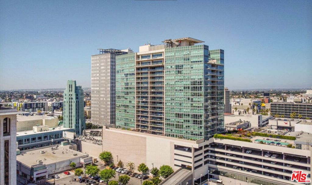Welcome to Solair, a prestigious high-rise offering chic luxury living in the heart of Koreatown at the historic intersection of Wilshire and Western. Perfectly situated as a gateway to DTLA, Beverly Hills, The Grove, Los Feliz, and Larchmont Village with easy access to the Purple Line Metro. This bright and airy 17th-floor residence features two bedrooms, two bathrooms, west facing with stunning views. The open floor plan is enhanced by floor-to-ceiling double-paned tinted windows, beautiful hardwood floors, and a gourmet kitchen with Caesar stone countertops, stylish Italian Bontempi cabinetry, and top-of-the-line Bosch stainless steel appliances including range/oven, microwave, refrigerator, dishwasher, and in-unit washer/dryer. The spacious master suite boasts a large bathroom and generous closet space. Additional highlights include central A/C and heating, two assigned side-by-side parking spaces and controlled access with 24/7 security and concierge. Residents enjoy resort-style amenities such as a pool, spa, private cabanas, BBQ area, dog park, fitness center with indoor and outdoor spaces, resident lounge with kitchen, conference room with computer and coffee station, and more. Just steps from the historic Wiltern Theatre, CGV Cinemas, supermarkets, restaurants, shopping, and on-site subway access, Solair offers a rare opportunity for luxurious urban living in one of Los Angeles's most vibrant neighborhoodstruly a must-see!