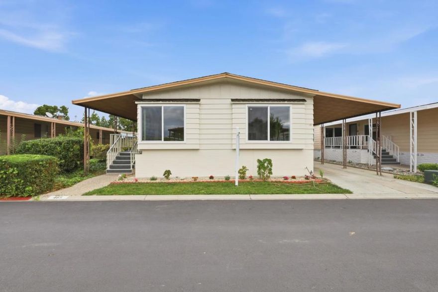 Welcome to this beautifully remodeled, move-in-ready home located in a well-maintained 55+ senior community. Offering 2 spacious bedrooms and 2 full bathrooms, this 1977-built residence features approximately 1,440 sq. ft. of comfortable living space. The separate living room provides added versatility and can be converted into a studio, office, or guest area. Recent updates enhance the home's appeal, while large windows fill the interior with natural light. Outside, enjoy a generous side deck perfect for relaxing or entertaining, along with a long driveway offering ample parking. Conveniently located near shopping, dining, and major commute routes, this home combines comfort, flexibility, and modern upgrades ready for its next owner. Low Space Rent in the amount of $1,156.