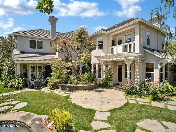 Calling all nature lovers and wine enthusiasts - The home of your dreams is finally being offered for sale. This property has been lovingly curated by its original owners, whose expert landscape knowledge and passion for wine is evident at every turn. The charm and impact of these award-winning grounds can only be fully appreciated in person. This home dazzles you from the moment you enter with double volume ceilings and a wall of windows, offering a beautiful view straight to the backyard. One of the most flexible designs in Palermo, this floor plan has everything you need. The first level boasts spacious living areas, a private guest suite and a charming office, complete with French doors leading directly to the rear yard. The island kitchen is perfect for entertainers. It provides a gracious walk-in pantry, stainless appliances including TWO dishwashers, a charming breakfast nook, counter seating and it flows seamlessly into the spacious family room which features extensive built-ins and a stone-faced hearth. On the second level, the primary suite enjoys a balcony overlooking the rear yard, a sunny sitting area, a custom wood built-in and a spacious bath with walk-in closet. You'll also find two secondary bedrooms with private, en suite baths and a generously sized bonus room that could easily be transformed into a fifth bedroom. Moving on to the exceptional rear yard, lush foliage, colorful blooms, Pennsylvania Blue hardscape and thoughtful lighting create the perfect backdrop for outdoor entertaining or simply relaxing on your own. Fill your home with fresh cut roses from the celebrity rose garden - including Miranda Lambert, Queen Elizabeth and Marilyn Monroe. Impress friends with a tasting in your own private wine cave! Temperature controlled and boasting built-in racks to accommodate over 500 bottles, your collection is always assured of proper storage. If you've been wanting to try your hand at winemaking, you'll love the established vineyard hosting 35 Chardonnay vines and 35 Pinot Noir. You're sure to be the envy of every true wine connoisseur! The free-from pool and spa, complete with water slide, grotto and multiple water features is the sparkling centerpiece of the backyard. Pour yourself a cold drink, hop on a raft and let your cares float away. Entertain friends in the bubbling spa, which seats up to 10 and features a stand-up area where jets soothe your entire body. It's all controlled by the Aqualink app or via the convenient panel located just inside the home for easy access. The award-winning landscape features an integrated drip and micro-spray system with a 'smart irrigation controller' for landscape water use efficiency. Manage it all from your phone through the Rachio app.Evenings are highlighted by cooler temperatures and romantic lighting. Cozy up at one of two fire pits. The first is thoughtfully placed just outside the wine cave and the second is located on the upper patio, adjacent to the vineyard. It's just like being in Tuscany! Perched at the top of the property, you'll find a third patio with a spectacular view of the surrounding mountains. It's the perfect spot for to star gaze and watch for shooting stars. For those with an eye for practicality and eco friendliness, the roof was largely reset in 2022, and the solar system for heating the pool was replaced entirely - maintaining swimmable water temps during sunny months. The home includes a remote controlled, recirculating hot water system, which quickly delivers hot water throughout the home. The gardens are served by a drip system, keeping water usage down AND this home also includes a Level 2 Tesla charger. Located on a quiet, gated cul-de-sac, this charming neighborhood boasts ideal weather and coastal influences. Enjoy a morning hike or bike ride in the beautiful Santa Monica Mountains, just a stone's throw away. This area is surrounded by protected open space - it's truly a hidden gem.