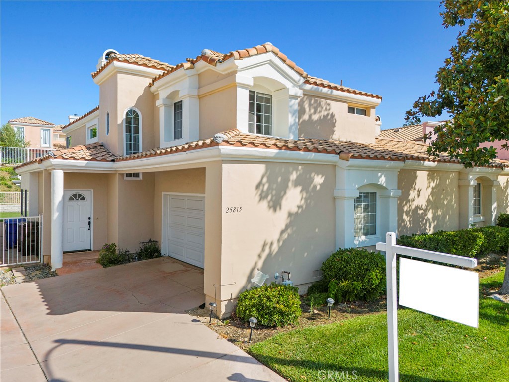 Located in the heart of Stevenson Ranch on a quiet cul-de-sac, this well-maintained home is just minutes from top-rated schools, the Stevenson Ranch Marketplace, restaurants, and offers easy freeway access. Featuring a bright and open floor plan, the home is in turnkey condition and ready for immediate move-in. The spacious living room includes a cozy fireplace, tile flooring, and plantation shutters. The kitchen is well-equipped with a built-in oven, microwave, stovetop, dishwasher, stainless steel sink, and sleek quartz countertops with a stylish tile backsplash. The home features two primary bedrooms upstairs and a third bedroom conveniently located on the main level. The upstairs laundry room adds extra convenience. Enjoy the spacious backyard, complete with a patio deck, low-maintenance artificial grass, and paver stones—perfect for outdoor entertaining.
