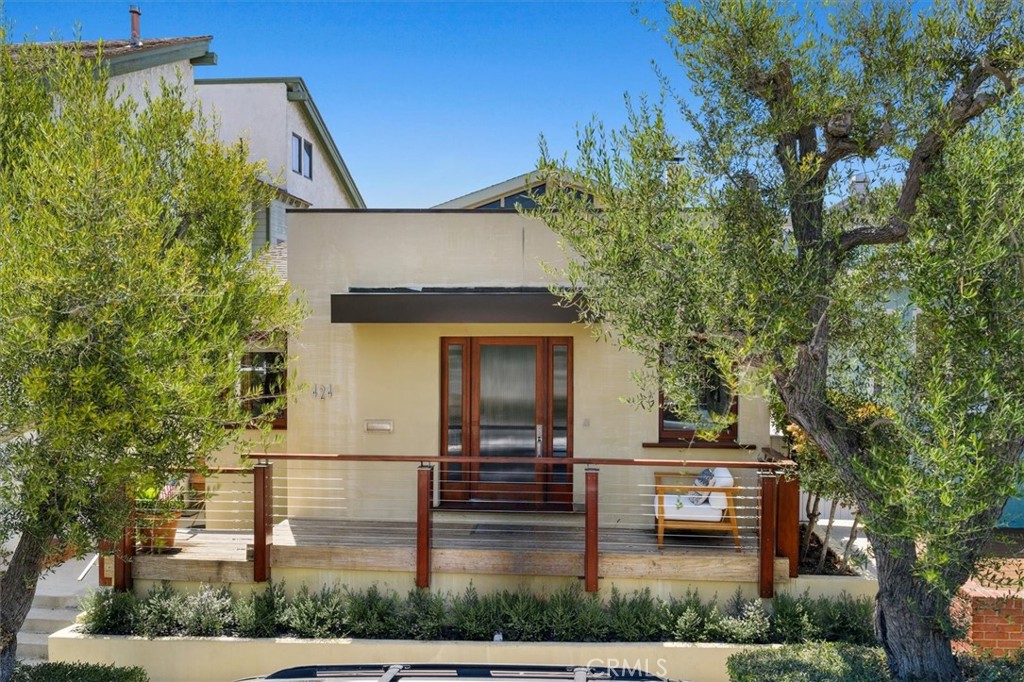 Situated on one of South Manhattan Beach’s most sought-after streets, 424 3rd Street is framed by olive trees and wide sidewalks, offering both beauty and walkability. This stunning, 2003 Jon Starr remodel boasts approximately 2,200 square feet of thoughtfully designed living space, including 3 bedrooms, 2 bathrooms, a dedicated office, and a seamless blend of style and functionality.
With a design inspired by coastal living, this home features elegant details such as teak deck railings, mahogany windows, and artisan finishes—capturing the essence of a traditional beach cottage with clean modern lines. It's the perfect coastal retreat for those seeking character, sophistication, and comfort.
Just a short stroll to award-winning Robinson Elementary, the beach, and the vibrant downtown filled with shops and restaurants, this home offers a true “flip-flop lifestyle” with an exceptional walkability score.
The primary suite is a standout, featuring vaulted ceilings, smooth plaster walls, extensive built-ins, a luxurious bathroom with custom stone flooring, and an impressive custom walk-in closet. The chef’s kitchen, flooded w/natural light from three new skylights, and equipped with a Sub-Zero refrigerator, Meile dishwasher, large Viking range and opens to the inviting family room. Large sliding doors offer views of the charming patio and side yard, creating an ideal flow for indoor-outdoor living. Additional highlights include: Multiple skylights bringing in abundant natural light, upstairs laundry room, two-car garage, private office adjacent to the primary suite, and one secondary bedroom currently configured as an office which can easily be converted back. In a market with limited inventory, 424 3rd Street stands out as a truly special offering—an exceptional home in an unbeatable, South of the Pier, quiet,
location.
