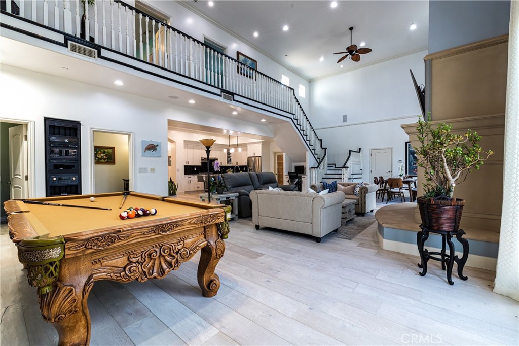 Magnificent Newer Construction in East Long Beach!
Welcome to 6266 E Metz Street, where luxury meets functionality. From the curb, the Spanish-style fountain and expansive gated driveway set the tone. The property features RV parking with hookups and a legal ADU with its own address and private access.
Step inside the main home to a formal foyer leading to a dramatic great room with two-story ceilings, recessed lighting, a glass gas fireplace, surround sound, and dual-zone heating and A/C. There’s space for a pool table alongside the open living, dining, and recreation areas, all flowing into a chef’s kitchen with oversized island seating six, walk-in pantry, quartz countertops, custom cabinetry, and premium stainless appliances.
The main floor offers two primary suites with ensuite baths, plus a guest bath. Upstairs, the luxurious master retreat boasts a spa-like bath with jacuzzi tub, custom rain shower, dual vanities, and a huge walk-in closet, along with an additional bedroom.
The backyard is built for entertaining: outdoor kitchen with grill, cooktop, fridge, and gas fireplace, plus covered seating and multiple gathering areas. A vegetable garden adds fresh herbs and greens to the mix.
The detached studio ADU is private and versatile—ideal for guests, rental income, or multi-gen living. Parking includes a 2-car garage plus room for 4+ cars in the driveway. Additional highlights:
Real hardwood floors
3 tankless water heaters
200-amp electrical panel
Solar panels (leased)
Ample storage throughout
All this in a prime location near shops, dining, El Dorado Park, golf courses, and top schools. Truly one-of-a-kind!