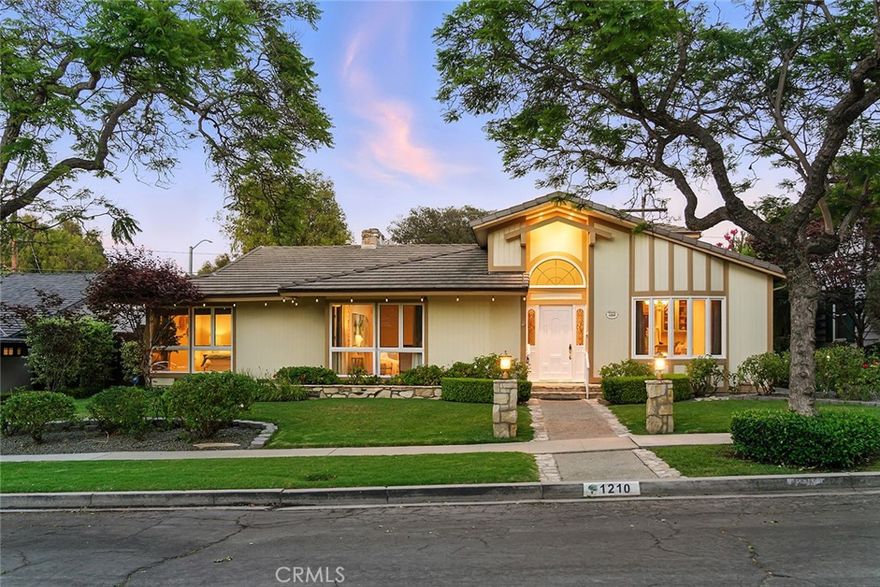 Welcome to Park Estates, one of Long Beach’s most notable neighborhoods, where tree-lined streets and custom homes set the stage for timeless elegance. This expansive 5-bedroom, 3.5-bath residence offers nearly 3,300 sq. ft. of living space on a generously lot, complete with a sparkling heated pool with waterfall and spa for year-round enjoyment. Step inside and your guests are greeted by a grand two-story foyer with soaring 18-foot ceilings, skylight, and an abundance of natural light. The formal dining room is ideal for memorable gatherings, while the beautifully appointed chef’s kitchen is as stylish as it is functional. Outfitted with top-tier appliances — including a Sub-Zero refrigerator and freezer, 6-burner Wolf stove, double oven, and built-in microwave — it also features stone counters, rich cabinetry, and a charming breakfast nook that invites casual mornings. Multiple living areas provide flexibility for entertaining or quiet retreats. The formal living room enjoys views of the lush front yard, while the spacious family room is anchored by a fireplace, built-ins, and seamless access to the backyard. The primary suite, located on the main level, offers direct outdoor access and a private bath, while additional bedrooms provide ample space for family, guests, or home office needs. Upstairs, two bedrooms and a beautifully remodeled bathroom add to the home’s versatility.  A 400 sq. ft. bonus room offers endless possibilities — an ideal cabana room as it opens to the backyard and pool could also be a media lounge, game room, gym, or creative studio. Outdoors, the private backyard is designed for entertaining, featuring a covered dining patio, built-in barbecue, and plenty of space around the pool and spa for lounging under café lights.  Additional features include hardwood and Travertine flooring, recessed lighting, central air and heat, copper plumbing, upgraded insulation, abundant storage, and a 50-year tile roof. With its thoughtful layout, refined finishes, and resort-style amenities, this home will appeal to the most discerning buyer.  Close to CSULB, shopping, restaurants and just minutes to the beach and Second Street.