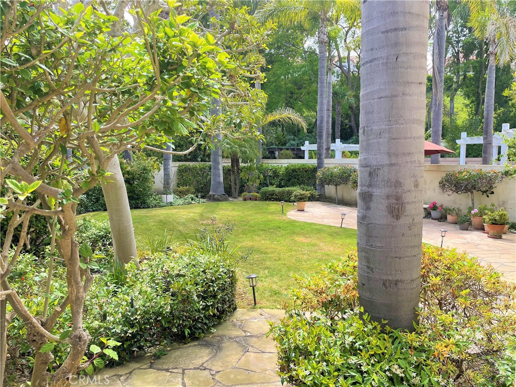 Hilltop Home peacefully located in the prestigious Vizcaya community of Laguna Niguel at Monarch Point. This home features 3 bedrooms, 2.5 bathrooms, totaling 2,406 square feet of comfortable living space. Appealing floor plan, as you enter this inviting home from a gated courtyard, you’re instantly greeted with high volume ceilings in the entrance, living room and an array of windows with plantation shutters allowing in an abundance of natural light. Formal dining room. Open gourmet kitchen with bar leading to the family room which includes exquisite granite counter tops, equipped with newer stainless appliances with an electric induction cooktop and convection oven. From the upgraded kitchen, breakfast nook, family room with a fireplace you won’t miss these sharp large picture windows to enjoy a peaceful view of the amazing, private, beautiful deep, large backyard impeccably landscaped complemented with a large grassy area surrounded by palm trees. An entertainer’s dream. Additional appointment include: brand new elegant wide-laminate wood flooring installed throughout the entire house,*On the second level, you’ll find a very spacious master suite with vaulted ceilings. *an extra-large retreat area which could be used for office space, fireplace, its own private deck balcony overlooking the spectacular, serene rear yard. Oversized master bathroom includes double vanities, walk-in closet, dressing area, separate glass enclosed step-in shower and whirlpool tub bathroom. Two secondary spacious bedrooms that share a balcony complete the upstairs. Convenient inside laundry located downstairs. Resort- style living. The prestigious Monarch Point coastal community provides amazing amenities and are just a short walk away, including ocean view pool, spa, tennis courts, and club house. Quick access to spectacular coastal ocean view hiking trails.