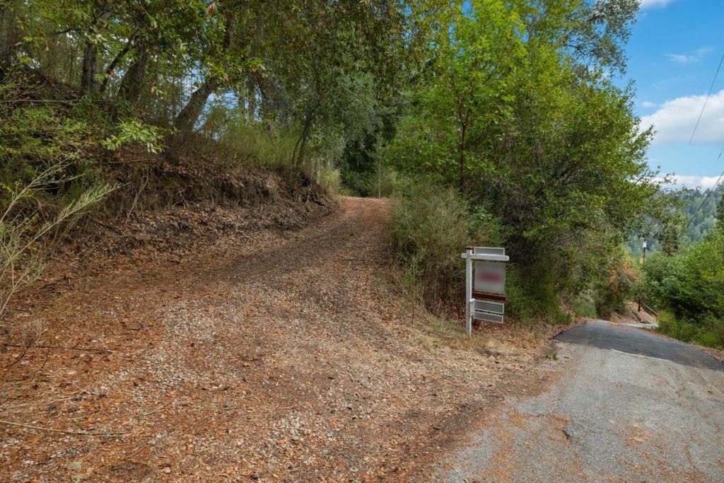 This stunning 3+ acre property offers breathtaking mountain views, a county-maintained access road, and an oversized building pad. While undeveloped, it includes an expired septic permit, a water department letter confirming serviceability, and a geotechnical compliance certificate. Seize this incredible opportunity to create your dream home - act now!