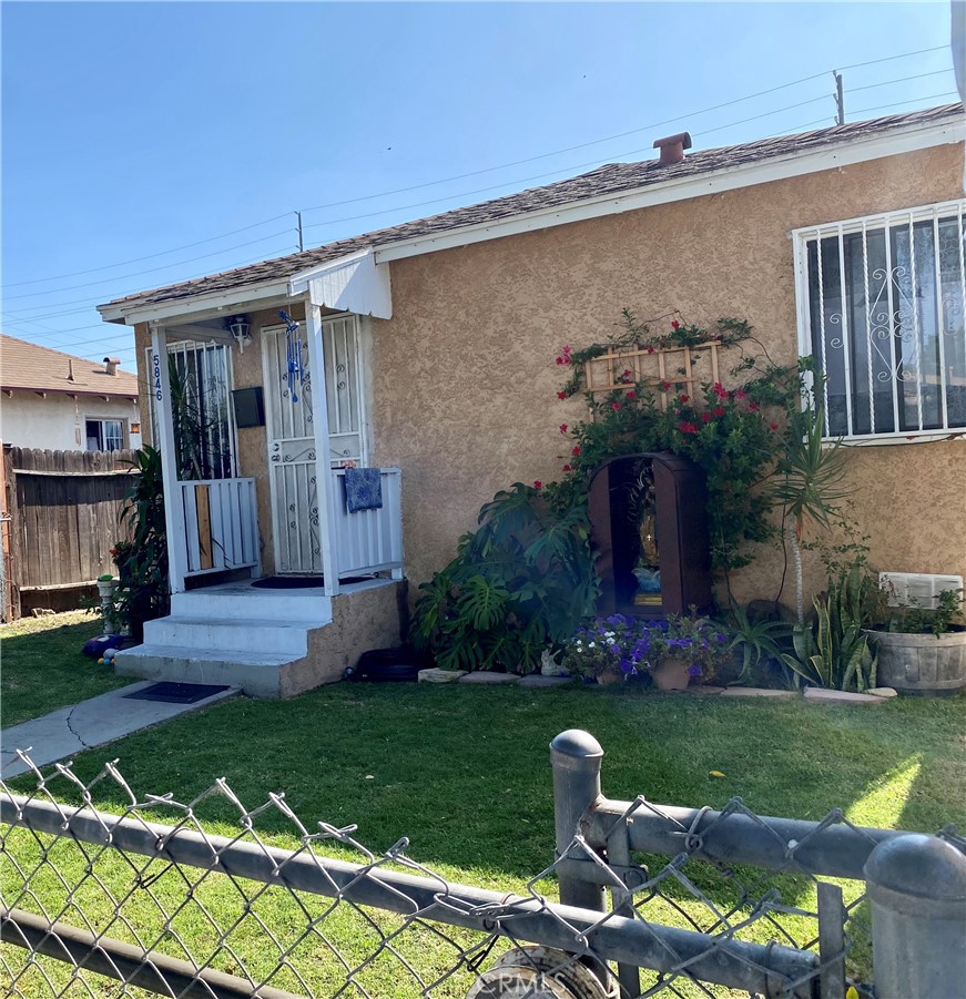 Great investment opportunity! Two small houses on one lot, approximately 800 sqft each, 2 bed 1 bath each. Wonderful for multi-generational living, or live in one and rent out the other, or purely as income property. Both properties are fully enclosed by fences with gates, and are accessible in the front on Gardenia and in the back from an alley. The front house faces Gardenia, with a large front yard and a long concrete driveway that will fit at least two cars. The rear house faces to the side, with a smaller front yard and an additional side yard. The back house has parking for two cars in the rear with alley access. There is a fence with sliding gate that goes across the entire back of the property. Next to the parking area is a detached 2 car garage, which could possibly be converted into a third unit, either by building out the garage itself, or adding a second story. Currently the property has parking for at least 6 cars, all off-street and behind gates. The front house has an upgraded kitchen and bath, and has been freshly painted inside. Don't miss this great investment opportunity!