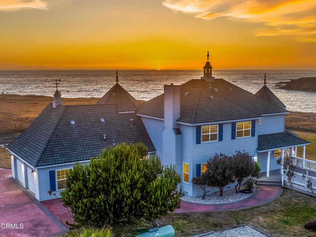 Perched above the Noyo Harbor, this charming Victorian-style home in Fort Bragg offers breathtaking ocean vistas with comfortable, modern amenities. Cozy up to the fireplace in the primary bedroom and enjoy a front-row seat to spectacular views of the ocean, the hustle and bustle of fishing boats gliding in and out of the harbor, or Coast Guard ships and helicopters practicing their maneuvers. Or enjoy the Jacuzzi tub built for two in the primary bathroom. Tour the rest of the home and you will find beautiful hardwood floors, comfy living spaces, a modern kitchen, and a delightful breakfast nook.Set on a spacious lot, the property offers a wrap-around deck and ample outdoor space for entertaining, enjoying the sweeping panoramas, and watching the local wildlife - be it soaring birds, bouncing jackrabbits, or a family of deer wandering on the property. The property includes a large two-car garage, a large driveway, and an RV parking area ample enough for the largest motorcoaches with water and 50 amp hookups for your guest's convenience. Come Fourth of July, the home transforms into a prime viewing spot for the spectacular Fort Bragg fireworks display, allowing you to beat the crowds and enjoy the event from the comfort of your own porch. With a single step off the property you have access to the scenic Pomo Bluffs Park - perfect for a sunset stroll or getting a closer view of migrating whales.This versatile home is conveniently located - one stoplight from Highway 20 to the south and to the north a bridge length away from Fort Bragg with its grocery stores, shops, and restaurants. Make the home your private coastal getaway or a large, centrally located base for your friends and family as you explore the stunningly scenic California coast.