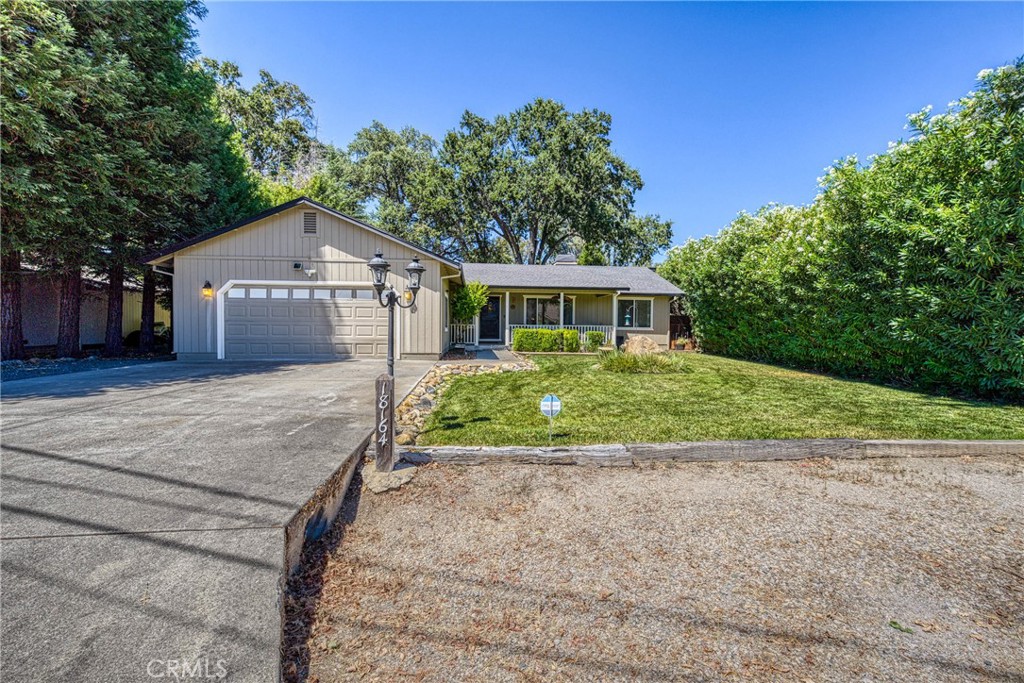 Tucked at the end of a quiet court, this spacious single-level home offers 5 bedrooms plus a flexible den—ideal for home office, playroom, or guest space. Four bedrooms are positioned in a dedicated wing alongside two bathrooms and a laundry room, making it easy to keep daily routines organized. The primary suite is privately located on the opposite side and features direct access to the backyard, an en-suite bath with double vanity and walk-in shower, and an attached den with glass French doors opening to the living room. The backyard is flat and level, thoughtfully maintained with shaded areas that create a safe, kid-friendly space perfect for playtime or relaxed outdoor gatherings. The main living area boasts vaulted ceilings, hardwood floors, and a fireplace, flowing seamlessly into the spacious kitchen with tile flooring, a large center island with propane cooktop, double oven, and generous sized pantry.