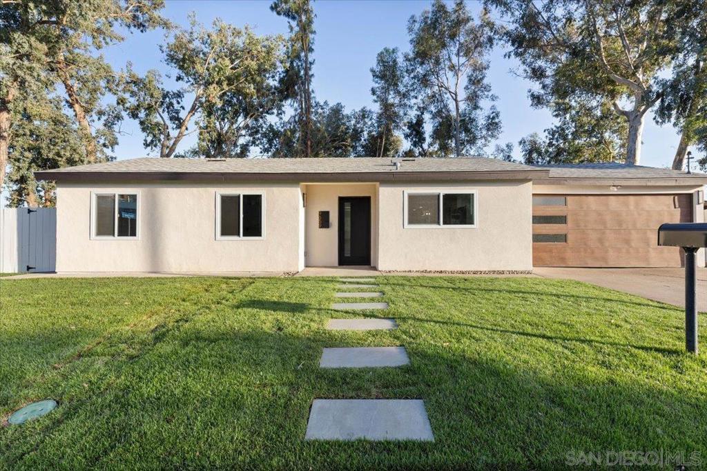 Welcome to 9659 Mast Blvd, a beautifully renovated 4-bedroom, 3-bathroom home situated on a spacious 0.26-acre corner lot in the heart of Santee. Offering 1,516 sq. ft. of modern living space and a 2-car garage with a brand-new garage door, this home has been thoughtfully updated with comfort and style in mind. Step through the modern new front door into an open, light-filled layout featuring brand-new LVP flooring throughout, recessed lighting, and dual-pane windows for energy efficiency and sound reduction. The centerpiece is the brand-new kitchen, showcasing quartz countertops, a stunning island with waterfall ends, and all-new appliances. Designed for today’s lifestyle, it flows seamlessly into the open-concept dining and living room, creating the perfect space for entertaining and everyday living. Modern light fixtures and a fresh neutral palette from the new interior and exterior paint elevate the design. The bathrooms have been fully renovated with new vanities, stylish tiled showers, and new tile flooring, blending function with contemporary finishes. The permitted additional bedroom and bathroom add flexibility for guests, multigenerational living, or a home office. Major upgrades include a new HVAC system, new fencing, new sod in the front yard, and new concrete poured in the backyard for additional entertaining space. Outdoors, the expansive lot offers endless opportunities for gatherings, gardening, or future expansion. Conveniently located near schools, parks, shopping, and freeway access, this turnkey home is the perfect blend of modern design and convenience!