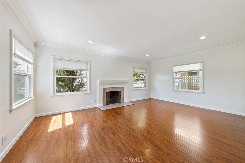 SINGLE-STORY CHARMING HOME WITH A PEACEFUL OUTDOOR HAVEN! Perched along a tree-lined street, step inside this quaint property and immediately notice the open and airy living spaces highlighted by a multitude of windows for exceptional natural light. Step right into the living area featuring a fireplace, perfect to cozy up to on the coming cold nights. The separate dining area opens up to the kitchen, perfect for entertaining guests. The kitchen is well equipped with granite countertops, stainless steel appliances and plenty of cabinets for storage. Freshly painted interior throughout for the lucky next tenants! Wood flooring throughout. 3 sizeable bedrooms with the primary suite directly opening up to the spacious backyard. Enjoy the serene oasis without the hassle of maintenance as gardening is included. Washer and dryer conveniently located in a separate room inside the property. 2-car detached garage with a long driveway and ample street parking. Conveniently located by many shops, markets, restaurants, schools and easy access to the 57 or 5 freeways. Short drive to Downtown Orange with great restaurants and bars.