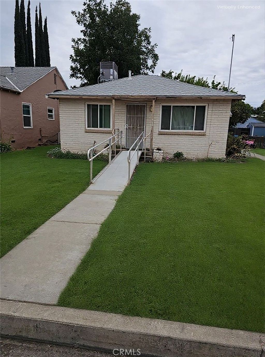 Photo of 114 N J Street, Madera, CA 93637 (MLS # FR25245341)
