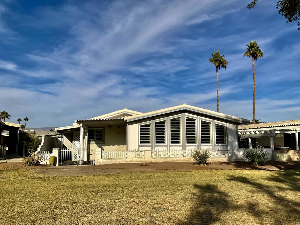 Another Fannie Mae Property. Palm Desert Greens Country Club. 55+ gated community. Home offers 1,960 square feet with 2 bedrooms, 2.5 bathrooms, living room, bonus room with wet bar, dining room and laundry room. Kitchen features white cabinetry, trash compactor, breakfast bar and built in desk. Primary bedroom features; dual vanities, soaking tub, walk in shower and walk in closet. Laundry room features a sink and desk area. Additional features include; vaulted wood beam ceiling, recessed lighting and ceiling fans. Enjoy the beautiful greenbelt and mountain views from the patio. Club house offers an active lifestyle with 18- hole golf, pro-shop, restaurant, lounge, fitness center, tennis courts, pickleball courts, pool, and spa. Low monthly HOA fee of $400.00 includes clubhouse; FREE golf, Wi-Fi, cable, and 24 hour guard gate. Manufactured home is on a permanent foundation with recorded 433, you own the land. Perfect Desert getaway or year round home. Central location, close to shopping, restaurants and freeway.