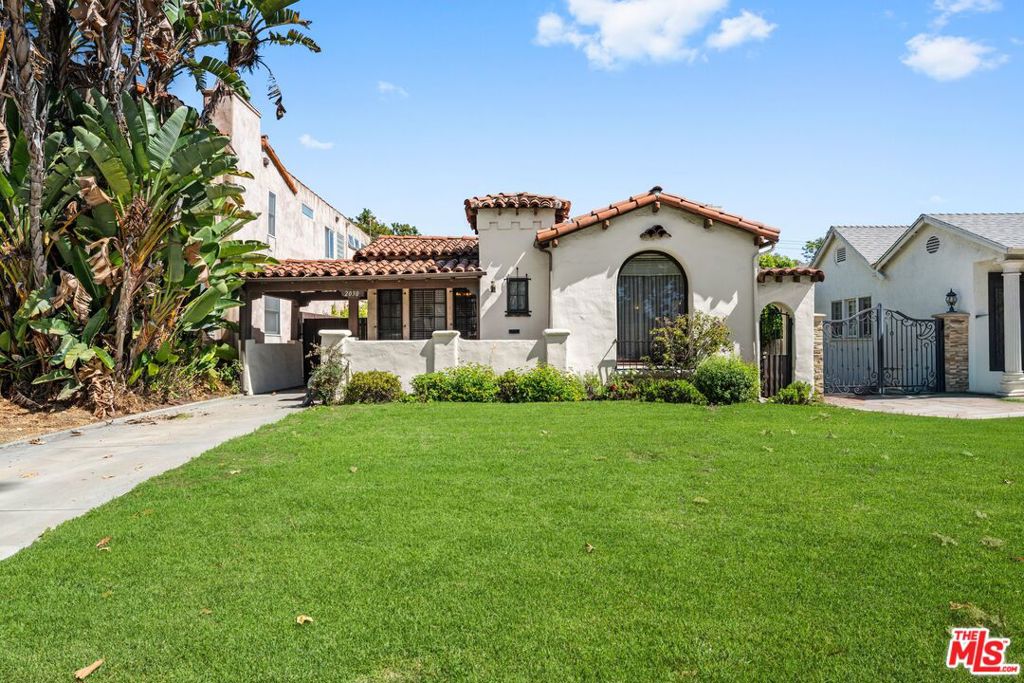 First time on the market in over 50 years! A true gem, this classic Spanish-style 3-bedroom home exudes original charm and endless potential. Bring your imagination and restore it to your own taste. Highlights include hardwood floors, a spacious living room with barrel ceiling and fireplace, and a formal dining room. The private yard and detached garage offer excellent flexibility, ideal for an ADU, home office, or playroom. Perfectly located just east of Overland with no Olympic noise, this home is minutes from Century City and the sought-after Westwood Charter Elementary School.