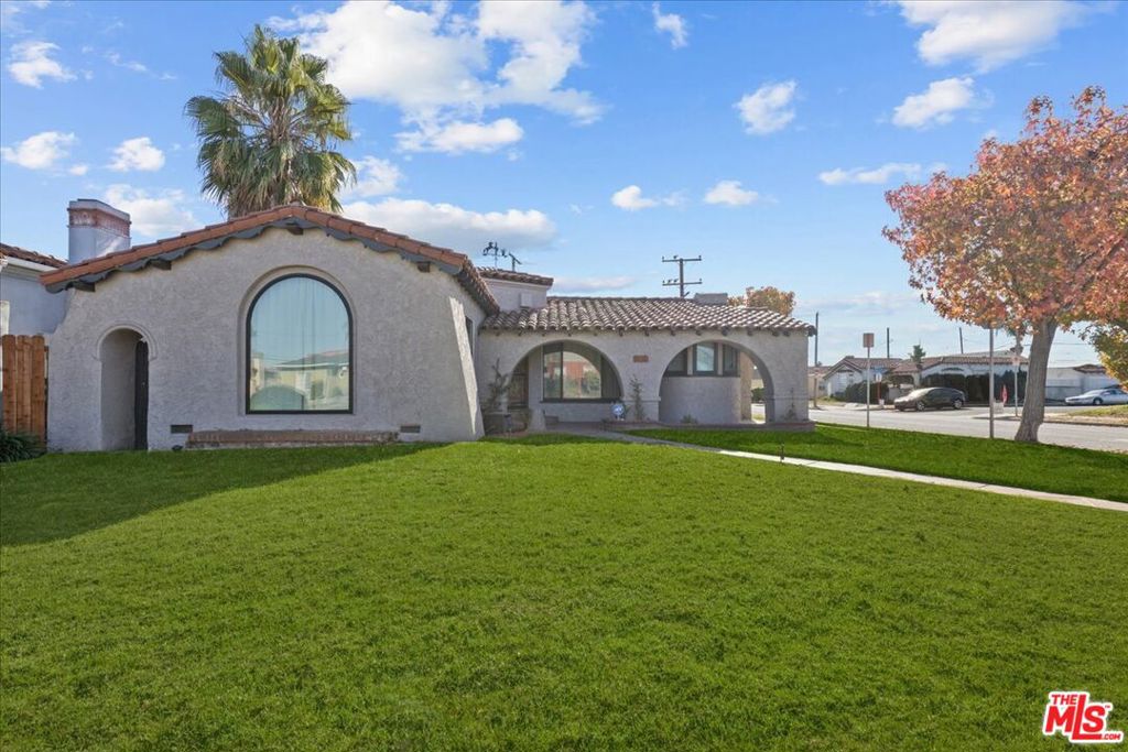 Now available for lease - back by popular demand! The last tenants absolutely loved calling this place home, and it's easy to see why. This thoughtfully renovated 1930s Spanish-style residence effortlessly blends charm, comfort, and convenience - set on a spacious corner lot in Inglewood's coveted Morningside Park. With 3 bedrooms, 2 bathrooms, and a detached 2-car garage, the home welcomes you with beautifully restored hardwood floors, graceful arched entryways, and soaring ceilings that flood the space with natural light. The living room is warm and inviting, featuring a stunning arched picture window, classic brick fireplace, custom light-filtering shades, and a striking white oak mantle that sets the tone. The formal dining room is perfect for hosting gatherings, while the brand-new kitchen is a chef's delight - complete with quartz countertops, shaker cabinetry, KitchenAid stainless steel appliances, custom white oak open shelving, a glazed ceramic tile backsplash, a walk-in pantry, and designer Roman shades. A built-in breakfast nook adds a cozy touch, ideal for morning coffee or winding down in the evening. Skylights illuminate the hallway that leads to three generously sized bedrooms, including a spacious primary suite with a custom California Closets system and a beautifully remodeled en-suite featuring a soaking tub, separate shower, modern vanity, and luxe finishes. A newly added 400 SF bonus room offers incredible flexibility - perfect as a 4th bedroom, home office, creative studio, playroom, or gym, with direct access to the backyard. The second bathroom has been stylishly updated with designer tile, a Kohler tub, contemporary lighting, and polished fixtures. Extensive upgrades include a brand-new roof, Milgard dual-pane windows, central HVAC, updated electrical and plumbing, recessed lighting, fresh interior/exterior paint, and more. Smart home features add even more convenience: Yale Smart Lock, Ring Doorbell and cameras, Nest thermostat, LG stackable washer/dryer, and a comprehensive security system. All this just minutes from the Inglewood Entertainment District - home to SoFi Stadium, the Kia Forum, the upcoming Intuit Dome, Hollywood Park, and more. You'll also enjoy quick access to parks, restaurants, shopping, freeways, public transit, and LAX. Charm, space, and sophistication - homes like this are a rare find.