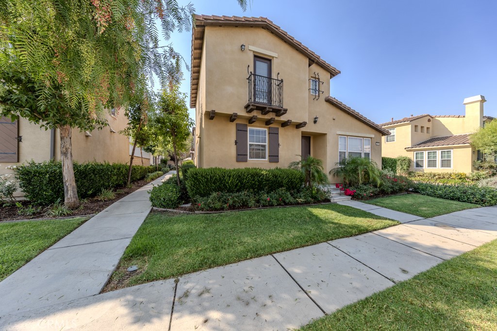 Detached single-family home in Dos Lagos within the Citrus Springs neighborhood. Located at 2874 Echo Springs Dr, Corona, this two-story property offers 3 bedrooms, 2.5 bathrooms, and 1,682 square feet. A major advantage is its proximity to The Shops at Dos Lagos, where shopping, dining, golf, and parks are all within walking distance.
The entry opens to laminate wood flooring across the first level. To the right, the living room features high ceilings, abundant natural light, and a fireplace. To the left, the kitchen includes upper and lower cabinetry, stone counters, a breakfast bar, recessed lighting, stainless steel appliances, and a walk-in pantry. The adjacent dining nook offers double doors that open directly to the backyard. A half bath and under-stair storage sit just off the kitchen, and interior access leads to the two-car garage.
Upstairs, new carpet runs throughout. The primary bedroom features high ceilings, a Juliet-style balcony, and a large walk-in closet. The en suite bath includes laminate wood flooring, dual sinks, a soaking tub, a walk-in shower, recessed lighting, and a separate toilet room. A loft-style landing between bedrooms offers a flexible space for work or reading. Two additional bedrooms with mirrored layouts share a full bath with laminate flooring, a single sink, and recessed lighting.
A separate laundry room upstairs provides built-in upper cabinets, a utility sink, and a folding counter. Outdoors, the backyard includes a concrete patio, a block wall for privacy, a garden bed, and a turf area for low-maintenance use.
Citrus Springs offers community amenities including a pool, spa, clubhouse, and playgrounds. Landscaped grounds and rolling hills frame the neighborhood, with Dos Lagos Golf Course, Dos Lagos Park, and The Shops at Dos Lagos nearby. Quick access to I-15 connects the property to surrounding cities. The home is located within the Corona-Norco Unified School District, which serves multiple elementary, middle, and high schools in the area.