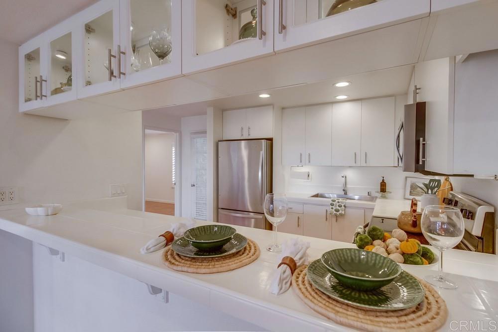 Ideal 2 bedroom, 2 bath condo with fantastic location at the base of Mission Hills and walkable to historic Old Town hustle & bustle. Light, bright, super clean with a wood burning fireplace. Standout features: City Light Views Laundry inside the condo 2 car (tandem style) parking space 1 locked storage unit Gated community with pool and exercise room Pet friendly community Easy access to the airport, trolly, Sunliner, Coaster, restaurants, shopping