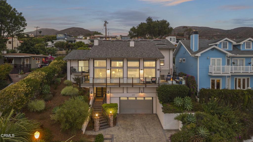Unobstructed Ocean Views | Expanded Living Space | Ventura Heights Perched in the prestigious Ventura Heights neighborhood, this beautifully remodeled hillside home captures sweeping 180-degree views of the ocean, Channel Islands, pier, and mountains from nearly every angle. Thoughtfully expanded, the home now offers four bedrooms, an office, and three full bathrooms, including a stunning new lower level with a spacious bedroom, office, and full bath--ideal for multigenerational living, guests, or a private work-from-home retreat.Upstairs, the main level boasts a light-filled living room with vaulted, beamed ceilings, oak plank floors, and floor-to-ceiling windows that frame postcard-worthy sunsets. The primary suite features its own ocean-view deck, fireplace, and a spa-like bath with a soaking tub and oversized shower. Two additional bedrooms are connected by a cleverly designed Jack & Jill bath with dual vanities and privacy doors.Outdoor living is exceptional, with a beautifully landscaped backyard complete with a built-in BBQ, firepit, and view terrace, perfect for entertaining or unwinding. Off the living room, an additional outdoor kitchen with BBQ and refrigerator extends your hosting space, all while enjoying panoramic views from the front deck. Upgrades include a newer roof and HVAC. Nestled near the end of a quiet cul-de-sac among newly built homes, this residence combines timeless design, modern convenience, and unparalleled views in one of Ventura's most coveted hillside enclaves.