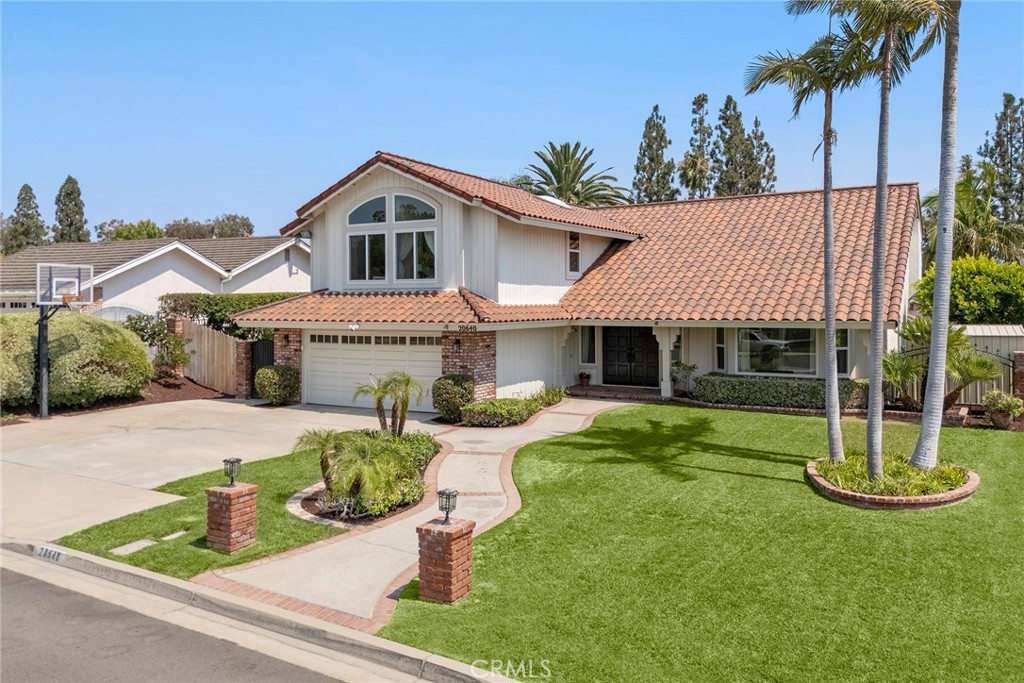 You’re going to fall in love with this home before you even make it to the front door! Beautifully landscaped and meticulously manicured, this home defines curb appeal. Step through the double doors into a lovely foyer overlooking the formal living room with cathedral ceilings and a bay window with a view of the front yard. Rich wood flooring adorns most of the floors in the home and plantation shutters grace many of the windows. The great room enjoys a wonderful view of the backyard and consists of a family room with fireplace and built-in cabinets, a beautiful breakfast room with cathedral ceiling, palladian windows and a stunning remodeled kitchen with crisp white cabinetry, quartz countertops, stainless steel appliances and an island with bar seating. Your private backyard paradise awaits with sparkling pool and spa, lush lawn and vegetation. Come and relax on the view deck overlooking the pool, shaded from the sun. There I also a covered patio for that summer meal. Wide side yards have the potential for RV parking. , on the first floor is a guest bathroom and the laundry room. Upstairs, you find a primary suite with a remodeled bath and abundant closet space. All bedrooms have plush carpeting, ceiling fans and shutters or blinds. There are four additional spacious bedrooms and 2 full baths to accommodate the needs of those bedrooms. The central location of this home is fabulous with several parks just minutes away, plus award winning schools, shopping, dining and entertainment. There is no better place to live than this. You belong here!