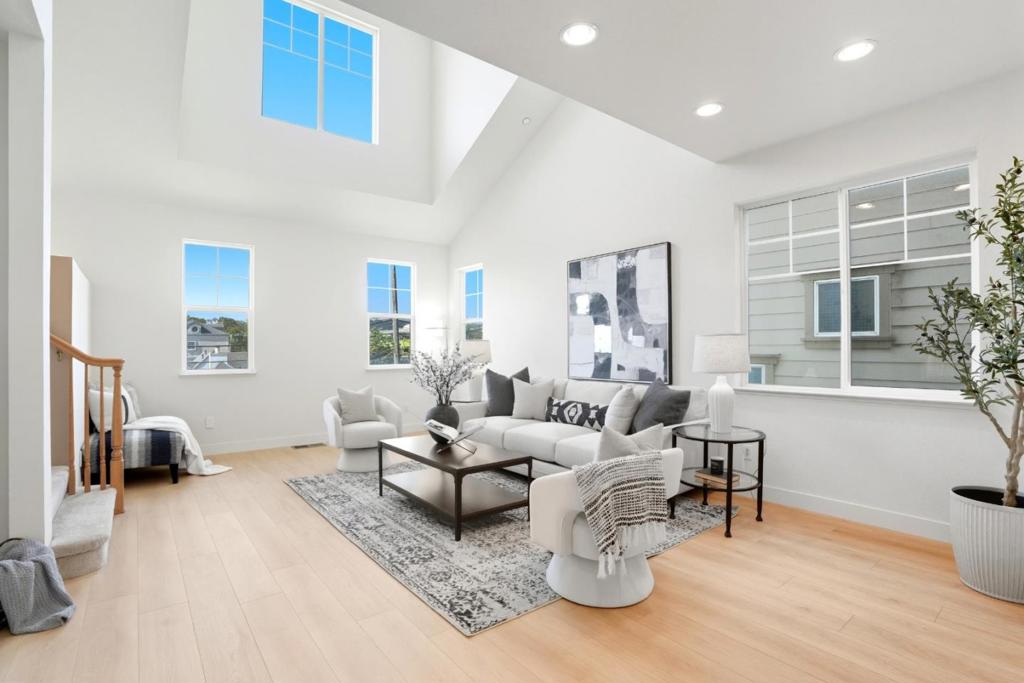 Welcome home to 956 Commercial Avenue, a newly renovated three-level single family home in sunny South San Francisco. This spacious residence offers three bedrooms, 3.5 bathrooms, new flooring throughout, and a large fenced front yard. The lower level includes a private bedroom with en-suite bathroom, a laundry room, and an attached two-car garage. On the main level, vaulted ceilings crown the living room, creating an airy gathering space alongside a half bathroom, a chefs kitchen with island and breakfast bar, a new dishwasher and gas stove, and an open dining area ideal for entertaining. Upstairs, you'll find two additional bedrooms and bathrooms. One bedroom features a mirrored closet and easy access to a full hallway bath with a shower-over-tub. At the end of the hall, the primary suite offers a walk-in closet and a private bathroom with a double-sink vanity and stall shower. Enjoy unbeatable convenience with nearby restaurants, shops, and amenities in downtown South San Francisco, plus close proximity to Kaiser Medical Center, BART, Caltrain, and Highway 101.