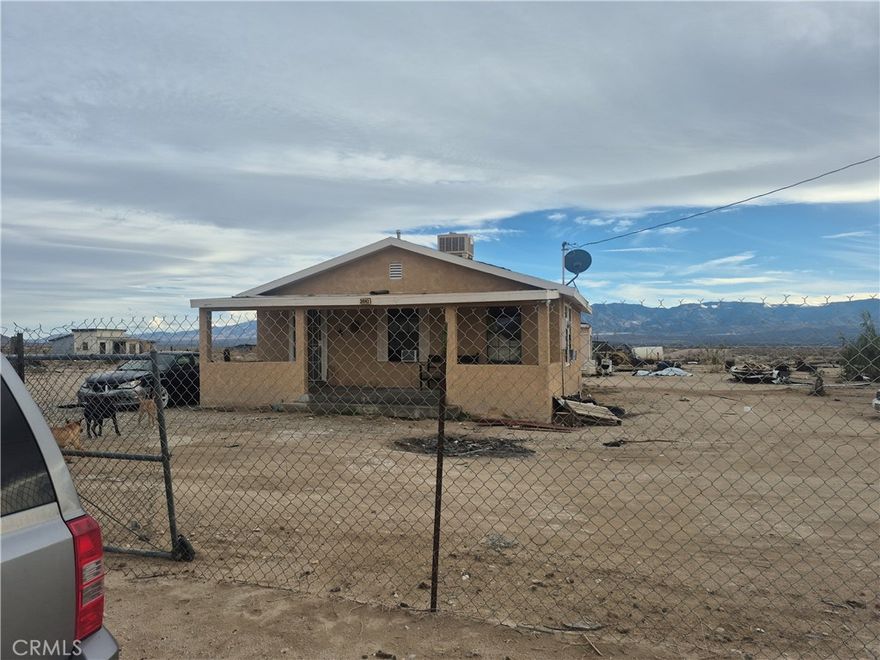 2 Bedroom 1 bath home on a huge 112,384 SQFT lot 2.58 Acres. Possibilities are endless