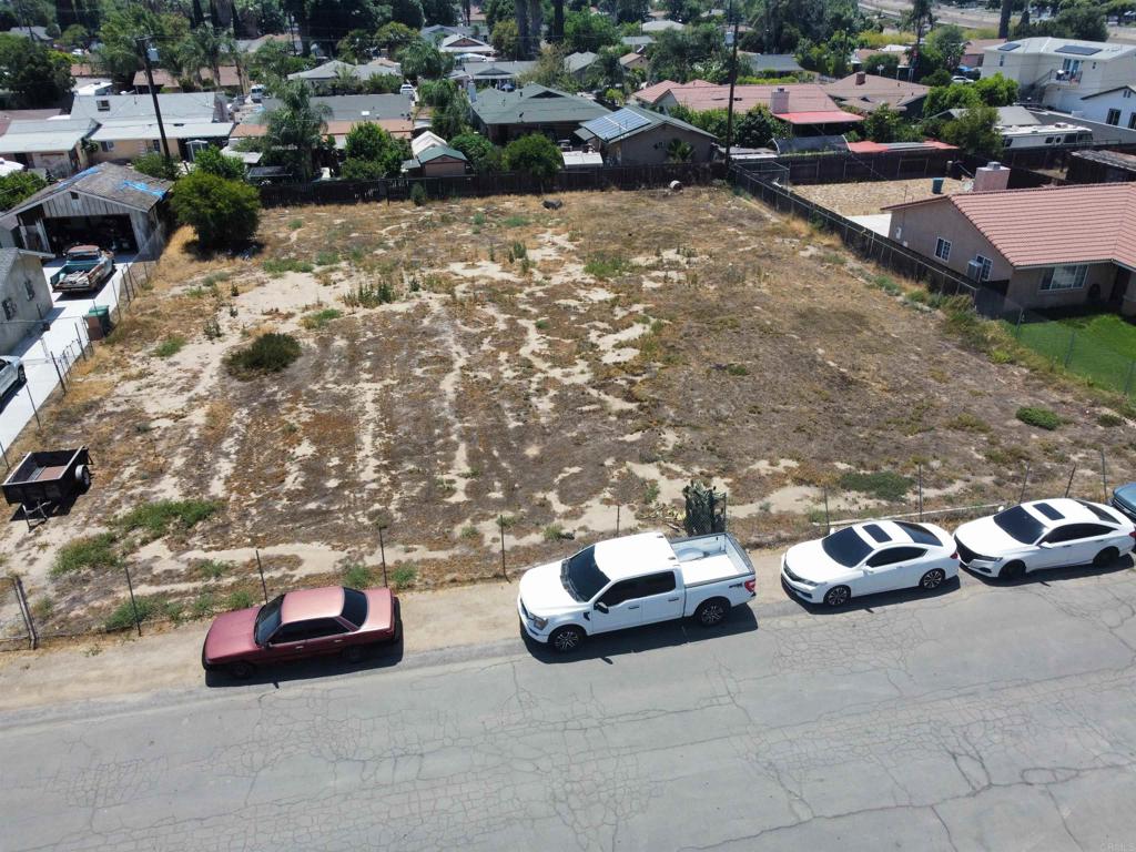 Incredible opportunity to build in a charming, established neighborhood in Corona. This spacious residential lot is zoned R-2, which means it is zoned to build a two-unit multifamily duplex and a possible ADU, but please check with the city for details. Build two units—live in one and rent out the other, or create a multi-generational living space. Located on a quiet street lined with single-family homes, duplexes, and triplexes, the neighborhood offers a welcoming atmosphere just minutes from key conveniences. The property benefits from easy freeway access—both I-15 and the 91 freeway are nearby, making commuting and regional travel seamless. Families will appreciate proximity to Home Gardens Academy (K–8) just 0.4 miles away, and Santiago High School, approximately 3.2 miles from the site. Outdoor enthusiasts will enjoy nearby parks and recreation, including Hidden Valley Nature Center and Louis Robidoux Nature Center within a short drive. Two additional lots are also available from the same owner on the same street—one is zoned R-1 and is directly adjacent to this lot (currently fenced together), and the other is zoned R-2 and located a couple parcels away. Buyers can choose to purchase this lot alone, pair it with either of the other parcels, or acquire all three together to build multiple homes, expand yard space, establish a family compound, or invest for the future. Utilities are nearby and can be easily connected as this is in a residential neighborhood. This represents a rare opportunity to build and invest in an established Corona neighborhood, offering flexibility, access, and long-term potential.