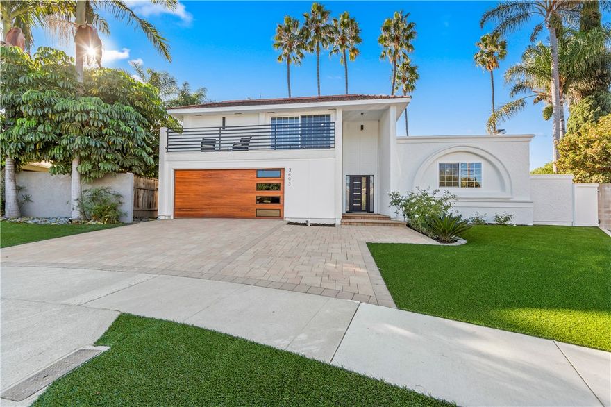 Experience the perfect blend of modern luxury and ideal location at 3493 San Marino Circle in Costa Mesa. This two-story corner-lot home is tucked away on a quiet cul-de-sac and showcases a complete designer transformation with refined finishes inside and out. A 20-foot entry welcomes you into a sunlit foyer and open entertainment area with a porcelain fireplace framed by custom wood paneling. The gourmet kitchen features Thor stainless appliances, custom wood cabinetry, porcelain countertops, and a 10-foot island perfect for gatherings. With 4 bedrooms and 3 bathrooms, including a main-floor bed and bath, the layout provides comfort and flexibility. Outside, the remodeled curved pool, paver patio, and turf yard create a true backyard retreat. The upgraded paver driveway and sleek garage door add curb appeal. Located minutes from South Coast Plaza’s luxury shopping and dining, local parks, and major freeways, this home offers the best of Orange County living.