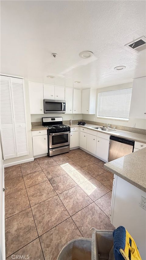 Photo of 15642 Pasadena Ave, Tustin, CA 92780 (MLS # SB26079122)