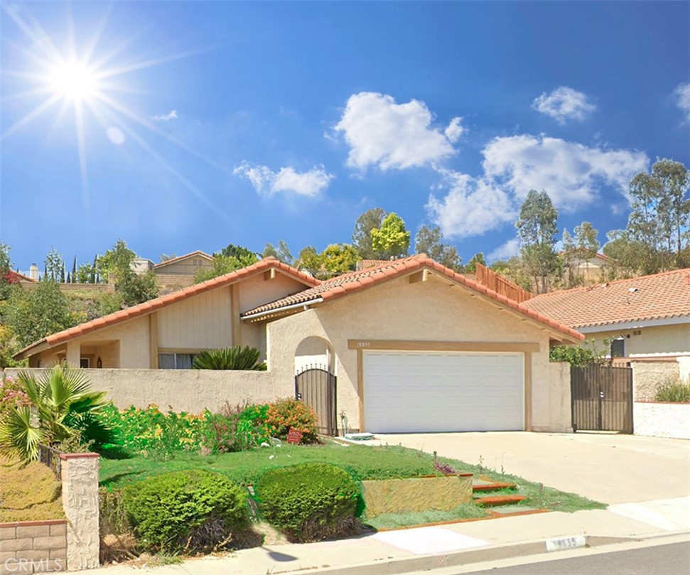 Modern Comfort Meets California Charm! Step into a sunlit sanctuary nestled in the coveted heart of Walnut—this single-story stunner is more than a must-see, it’s a must-feel. With 1,463 sq ft of perfectly crafted living space, this 3-bed, 2-bath beauty effortlessly blends form and function, making every inch feel grander than its footprint. The inviting kitchen is a dream in daylight, framed by natural sunlight and thoughtfully designed with generous storage for every culinary ambition. Your living and family room welcomes with soaring ceilings, sleek recessed lighting, and a cozy fireplace that anchors the space. Slide open the wide glass doors and let your indoor comfort spill into the sprawling backyard—made for endless summer BBQs and memorable soirées. Wrapped in privacy, the expansive 10,344 sq ft lot offers concrete patio space, a versatile side yard perfect for your home-grown harvest, and plenty of potential for future expansion or creative landscaping. Stroll along Walnut’s iconic horse trail, swing by nearby shopping and dining, or just soak up the serenity. This location delivers both a quiet retreat and a convenient connection. Let this home be your canvas for modern living, where every corner is curated for comfort, style, and possibility.