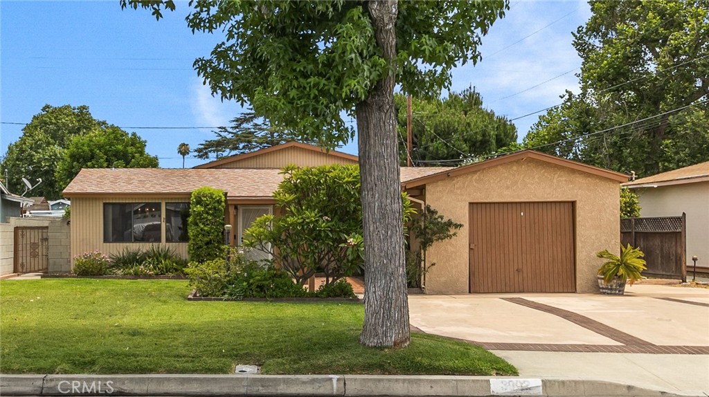 Welcome to 3902 N Morada Ave in the highly desirable area of Covina. First time on the market in 60 years! This inviting single-story home presents a generous layout which features 4 bedrooms, 2 bathrooms, a custom built-in wet bar, in-door laundry room and 2166 sq. ft. of thoughtfully designed living space on a 6949 sq. ft. lot. Stepping inside, you're immediately welcomed by the warm living room with the dining room on the left. The living room has a seamless flow that leads to the built-in wet bar and generous sized family room with vaulted ceilings, cozy gas fireplace, two ceiling fans with lights and a sliding glass door with access to the backyard. The kitchen offers a gas stove, two electric double ovens for effortless entertaining, a clever appliance garage to conceal appliances, ample storage with slide out shelves and a lazy susan in the corner cabinet. The kitchen has a pocket door for privacy if needed. Enjoy the serenity of the backyard from your primary bedroom, featuring sliding glass doors that open to the patio. The backyard is a cohesive extension of the home showcasing a large covered patio with lights, a shuffleboard game painted on the back patio floor (equipment is included), two large custom built sheds, a Meyer lemon tree and tangerine tree. The lush landscaped front yard has a large driveway (can park up to 5 cars) with RV parking, RV water hookup, RV electrical hookup and sewer dump for the RV. There is a one car attached garage which includes custom built storage shelves and custom built workstations. Double paned windows throughout the home with central heating and cooling. An attic with a pull down ladder can be found in the family room for additional storage. This gem is centrally located to the 10 FWY, Plaza West Covina shopping, parks, great restaurants and numerous entertainment options. Don’t miss out on this captivating home. Schedule a private tour today!