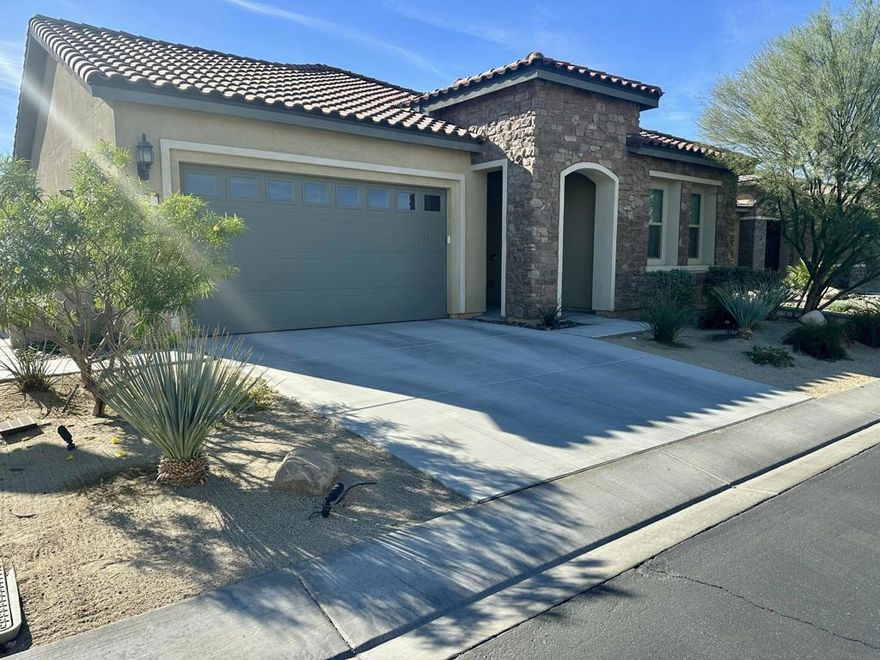 Welcome to Del Webb Rancho Mirage -- a masterfully planned 55+ community where resort-style living meets timeless desert elegance.This highly sought-after Preserve floor plan exudes Tuscan-inspired charm and offers 2 bedrooms, 2 bathrooms, and a versatile den/flex space -- ideal for a home office, media room, or creative studio.Step inside to discover refined details throughout, including custom window treatments, designer ceiling fans, and elegant tile flooring. The open-concept living area centers around a chef's kitchen, featuring an upgraded Whirlpool appliance package with dual ovens, premium soft-close cabinetry, quartz countertops with a full backsplash, a spacious island with pendant lighting and seating, and a walk-in pantry.The kitchen flows seamlessly into the expansive living and dining areas, highlighted by dual upgraded sliding doors that open to an extended covered patio and expanded hardscape -- the perfect setting to enjoy breathtaking mountain views and twinkling city lights. Whether entertaining guests or relaxing outdoors, the space offers an inviting atmosphere for every occasion.Your private retreat awaits in the luxurious primary suite, featuring a spacious layout, upgraded vanity sconces, dual sinks with quartz countertops, premium cabinetry, a large walk-in shower with quartz surround, and a generous walk-in closet. The guest bedroom and enclosed den/flex space are thoughtfully positioned on the opposite side of the home for optimal privacy, accompanied by a full secondary bath.Additional highlights include leased solar (approx. $113/month), an expanded laundry room with utility sink and extra cabinetry, and an oversized, fully painted garage with room for an extra-large vehicle or additional storage.Within the gates of Del Webb Rancho Mirage, residents enjoy a dynamic and engaging lifestyle with access to a state-of-the-art clubhouse, resort-style pool and spa, fitness center, and a variety of activities including pickleball, tennis, bocce ball, and more.Experience the perfect balance of luxury, comfort, and community in one of the desert's most coveted 55+ addresses.