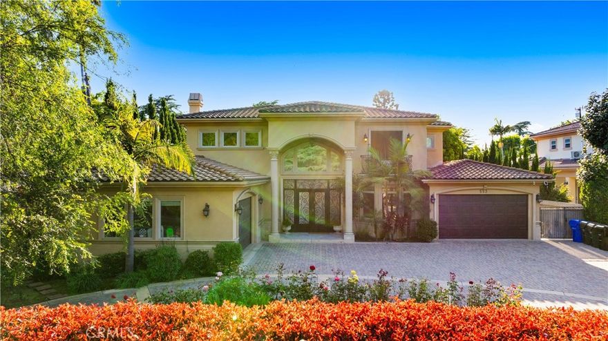 Don’t miss this rare opportunity to own a beautifully designed estate in Pasadena’s prestigious Michillinda Park neighborhood. Set on an expansive 18,516 sq ft lot, this remarkable residence offers approximately 5,953 sq ft of living space, featuring 6 spacious bedrooms and 7 bathrooms. The thoughtfully designed floorplan includes two main-level bedrooms ideal for guests or multigenerational living. The luxurious primary suite includes dual walk-in closets, a spa-style bathroom with a jacuzzi tub and steam shower, and a private balcony. Interior highlights include soaring ceilings, elegant chandeliers, custom woodwork, and marble flooring. The home is equipped with a spacious open-concept gourmet kitchen and a separate wok kitchen. Formal living and dining rooms, a family room, and a private office offer comfort and flexibility. Both the front and back yards are professionally landscaped with a year-round blooming rose garden. Peacocks are known to occasionally visit the grounds, adding charm and natural beauty to the setting. This is a rare blend of elegance, comfort, and tranquil outdoor living in one of Pasadena’s most desirable locations.