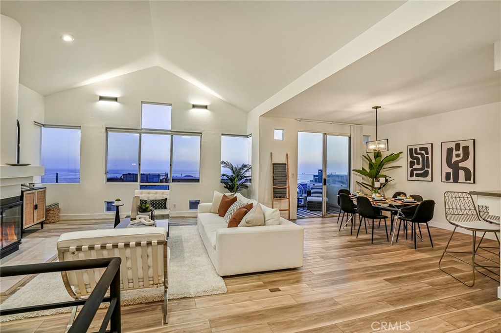 This contemporary townhouse looks amazing, and we think you'll agree! We just finished an extensive remodel and love how it turned out! Live just steps from the sand in this west facing gem with panoramic white water ocean views. But come see for yourself! Or think of it for its great short term furnished rental potential. Most of the lighting has been replaced with contemporary matte black fixtures. This theme has been carried into the new luxurious master bath with black matte fixtures in the soaking tub and walk-in shower. The entry foyer has ocean views as the does the master suite and second bedroom. Come upstairs (black matte handrails & new low pile charcoal carpet stairs) and be blown away the huge expanse of windows and the panoramic ocean views. Sit at the breakfast bar or have a sip of wine on the outside deck...this is a great place to entertain. There's a wine refrigerator in the stylish kitchen with stainless steel appliances. And if you like to surf, you are close to what is considered one of Southern California's best surfing locations! Parking is easy...2 side by side spots in the secure gated garage plus another dedicated parking space on Crest Drive. Low HOA dues. This home is located in Manhattan Beach's very desirable north end, close to great restaurants, the Strand, shops, and award-winning schools. LAX and the freeways are nearby. This is more than a home...It's the coveted Manhattan Beach lifestyle.