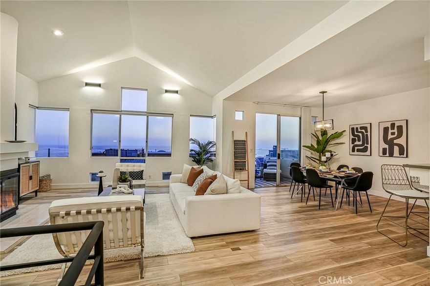 This contemporary townhouse looks amazing, and we think you'll agree! We just finished an extensive remodel and love how it turned out! Live just steps from the sand in this west facing gem with panoramic white water ocean views.  But come see for yourself! Or think of it for its great short term furnished rental potential. Most of the lighting has been replaced with contemporary matte black fixtures.  This theme has been carried into the new luxurious master bath with black matte fixtures in the soaking tub and walk-in shower. The entry foyer has ocean views as the does the master suite and second bedroom. Come upstairs (black matte handrails & new low pile charcoal carpet stairs) and be blown away the huge expanse of windows and the panoramic ocean views.  Sit at the breakfast bar or have a sip of wine on the outside deck...this is a great place to entertain. There's a wine refrigerator in the stylish kitchen with stainless steel appliances.  And if you like to surf, you are close to what is considered one of Southern California's best surfing locations!  Parking is easy...2 side by side spots in the secure gated garage plus another dedicated parking space on Crest Drive.  Low HOA dues.  This home is located in Manhattan Beach's very desirable north end, close to great restaurants, the Strand, shops, and award-winning schools.  LAX and the freeways are nearby. This is more than a home...It's the coveted Manhattan Beach lifestyle.