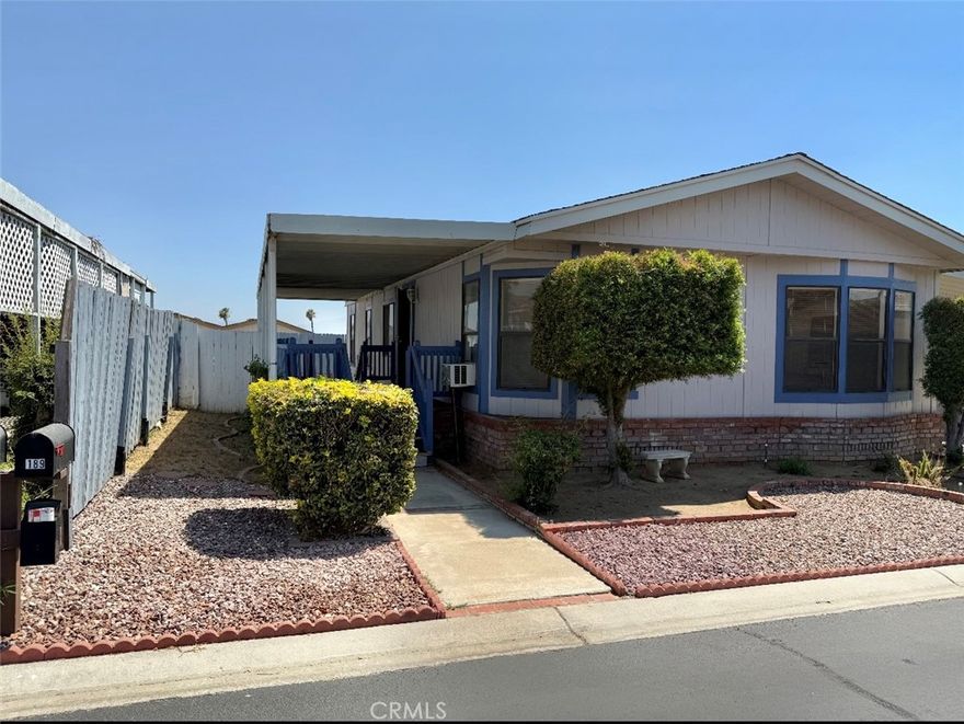 STOP RENTING!! Start building your own equity! This well-maintained Manufactured Home is waiting for its new proud homeowner. A gem nestled in a peaceful, well-established, all-ages mobile home community in Jurupa Valley, features amenities like a huge club house, function hall, meeting room, a pool, spa, 2 saunas, a billiard room, a dedicated car washing area, proximity to shopping centers, restaurants, entertainments as well as easy access to the 60 freeway. With a scenic mountain view, this lovely 2 bed 2 bath home offers an open spacious living and dining area, a functional kitchen with ample storage, a primary bedroom with a 4 piece ensuite, a private porch, large indoor laundry area, decent-sized yard, shed (outside storage), huge tandem 3 car carport area/covered patio and is situated in a gated community. it's move-in ready and includes all appliances. This friendly neighborhood home is perfect for first-time home buyers and down-sizers. Come and enjoy this cozy and peaceful lifestyle.